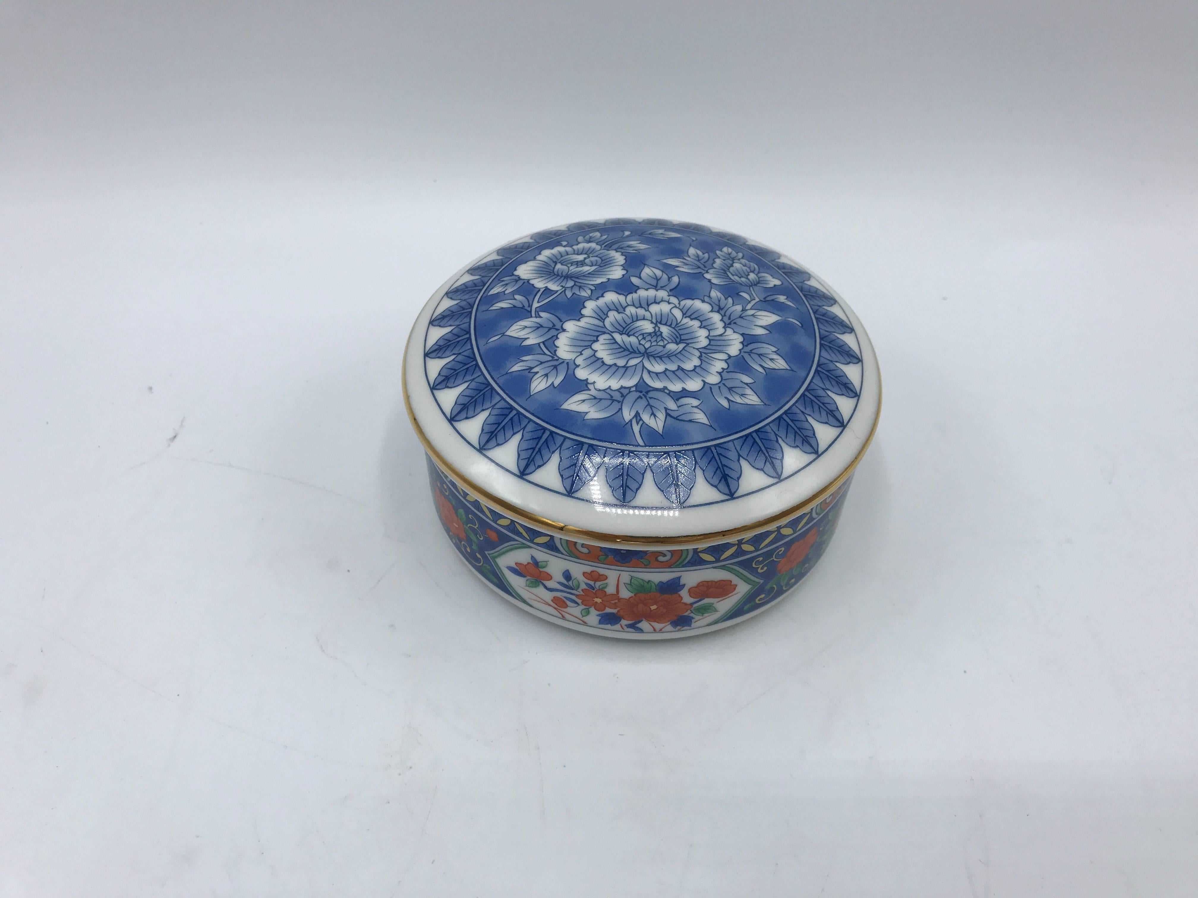 Offered is a gorgeous, 1980s Tiffany & Co. blue and white chinoiserie lidded bowl with a hand-painted floral motif and gold border.