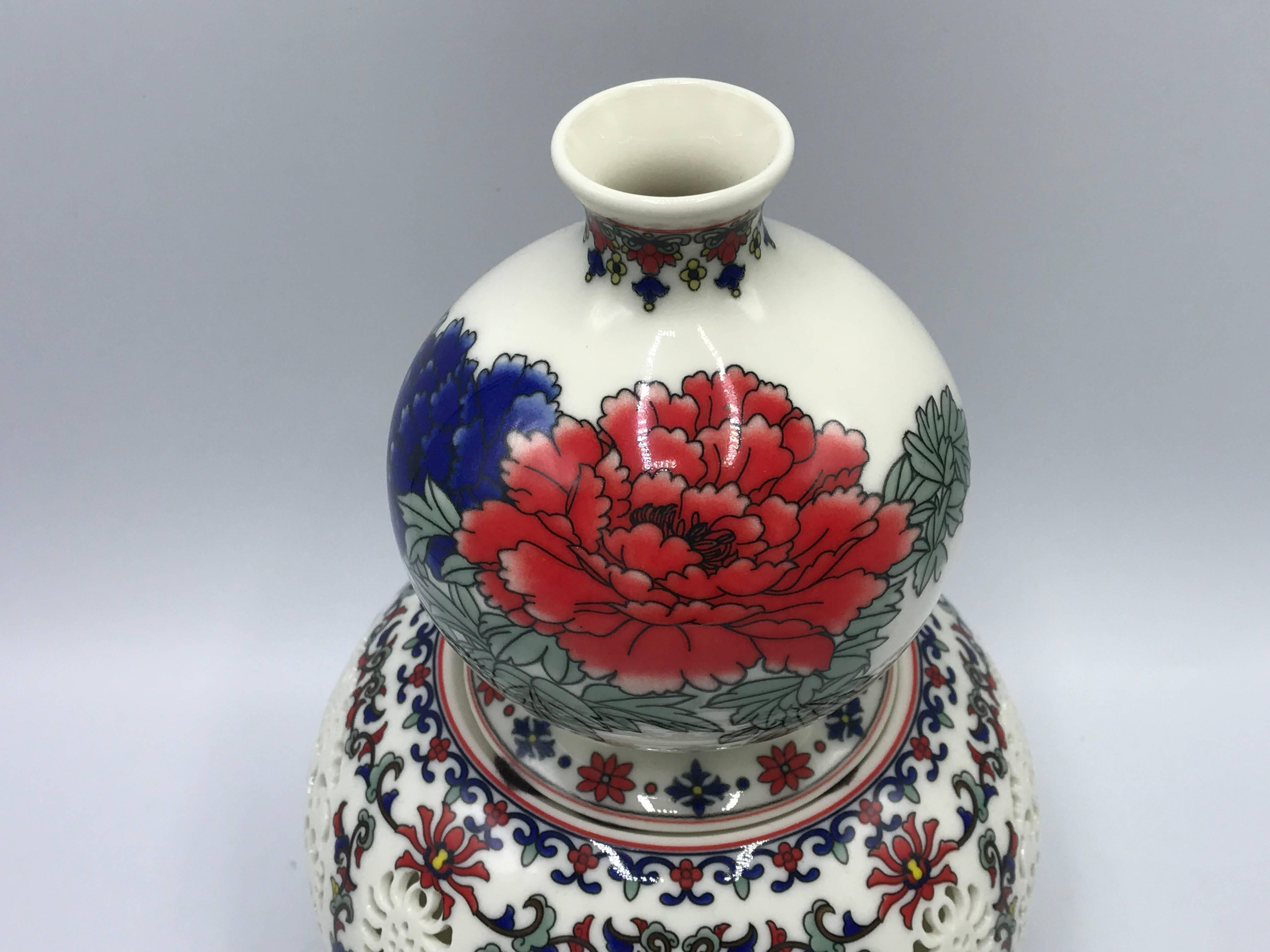 Offered is a stunning, 1960s Blanc de Chine porcelain pierced vase with a floral motif. Two pieces, see 'Image 5'.