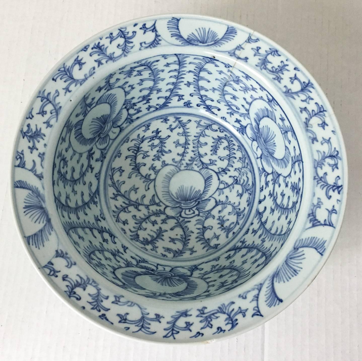 Offered is a beautiful example of traditional salt glazed blue-and-white porcelain, this exquisitely decorated bowl begs close inspection to appreciate its intricate vine detail. Accented with large violet-like blooms, the decoration possesses a