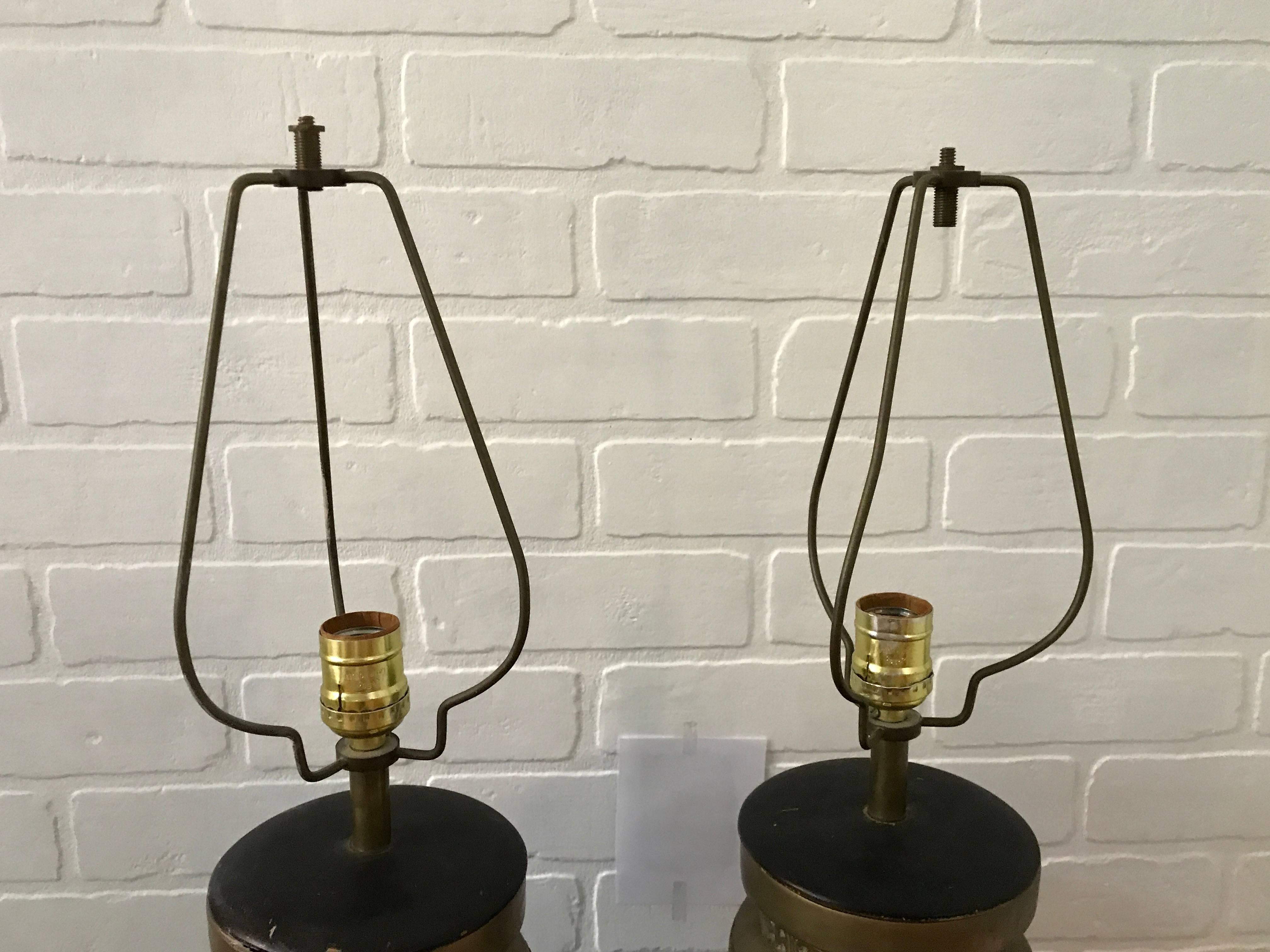 Offered is a stunning and substantial, pair of 1970s James Mont style bronze Asian lamps. Decorative wooden bases. Extremely heavy. 22" from base to socket.