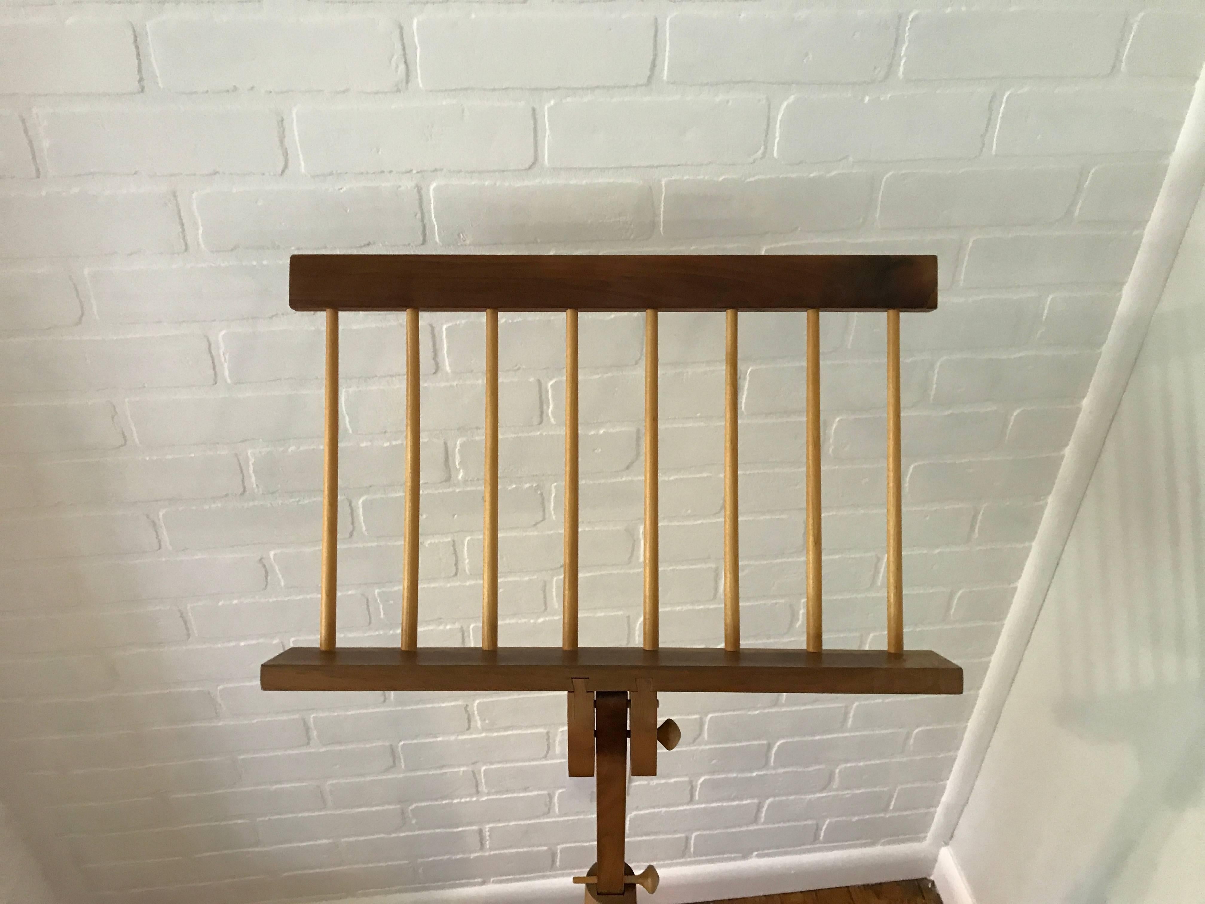 Offered is a stunning, 1960s modern American craft artisan music stand by Tom Dumke in the style of George Nakashima.