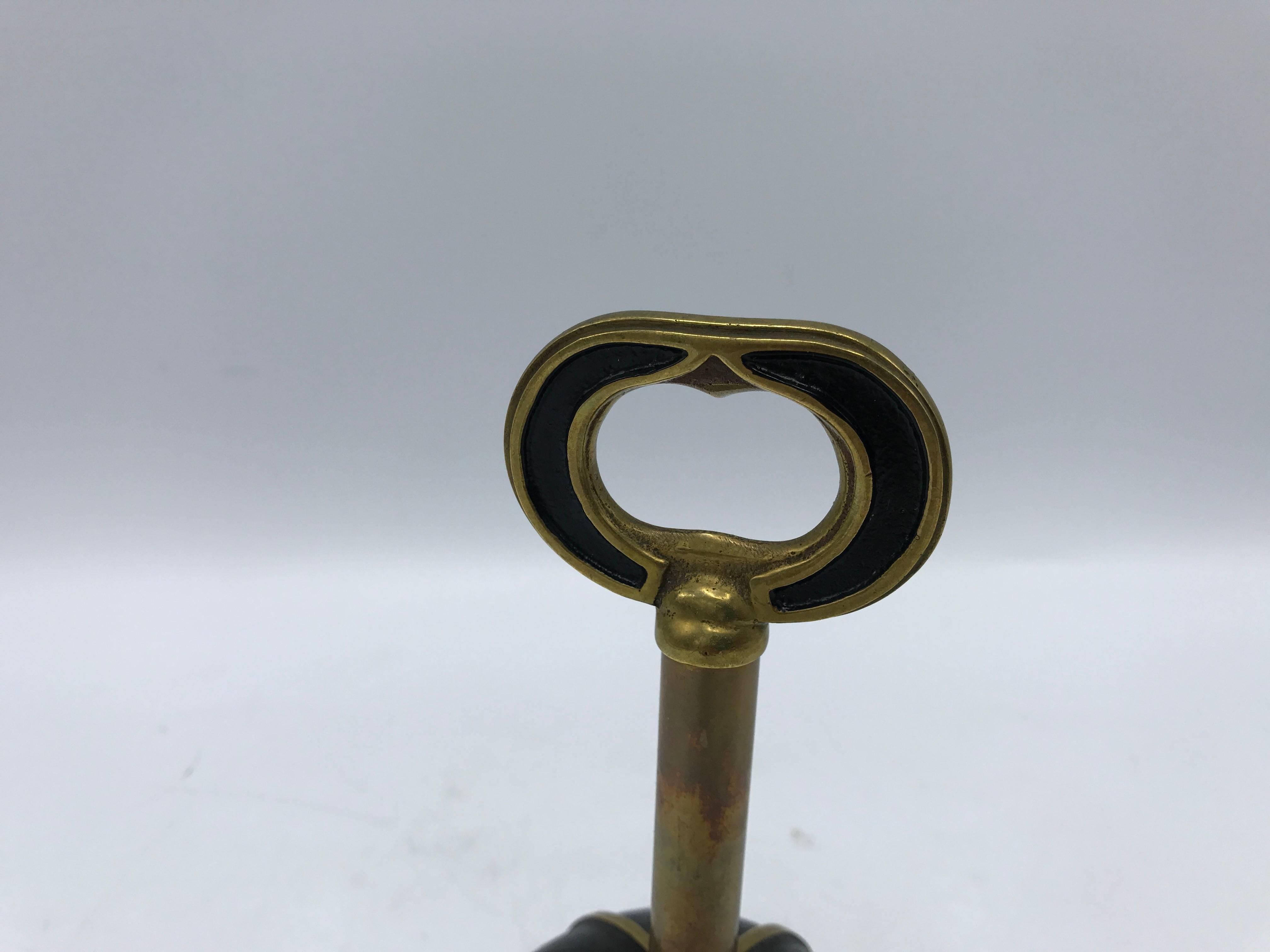 Offered is a stunning, 1950s brass/bronze wine corkscrew, bottle opener, and bell. Marked: Austria.