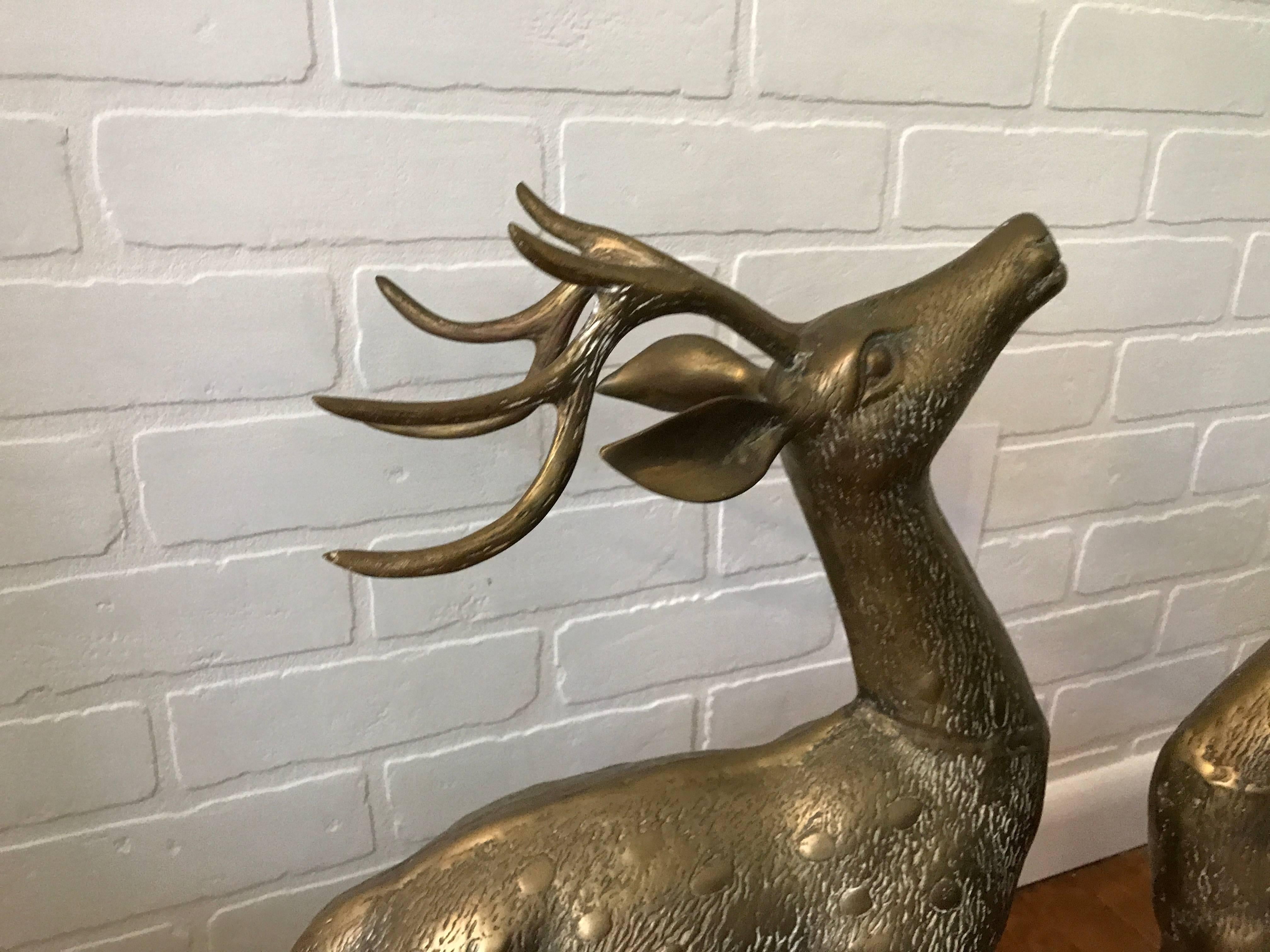 Offered is a gorgeous pair of 1960s brass deer sculptures. Mirrored image sculptures. Extremely heavy.