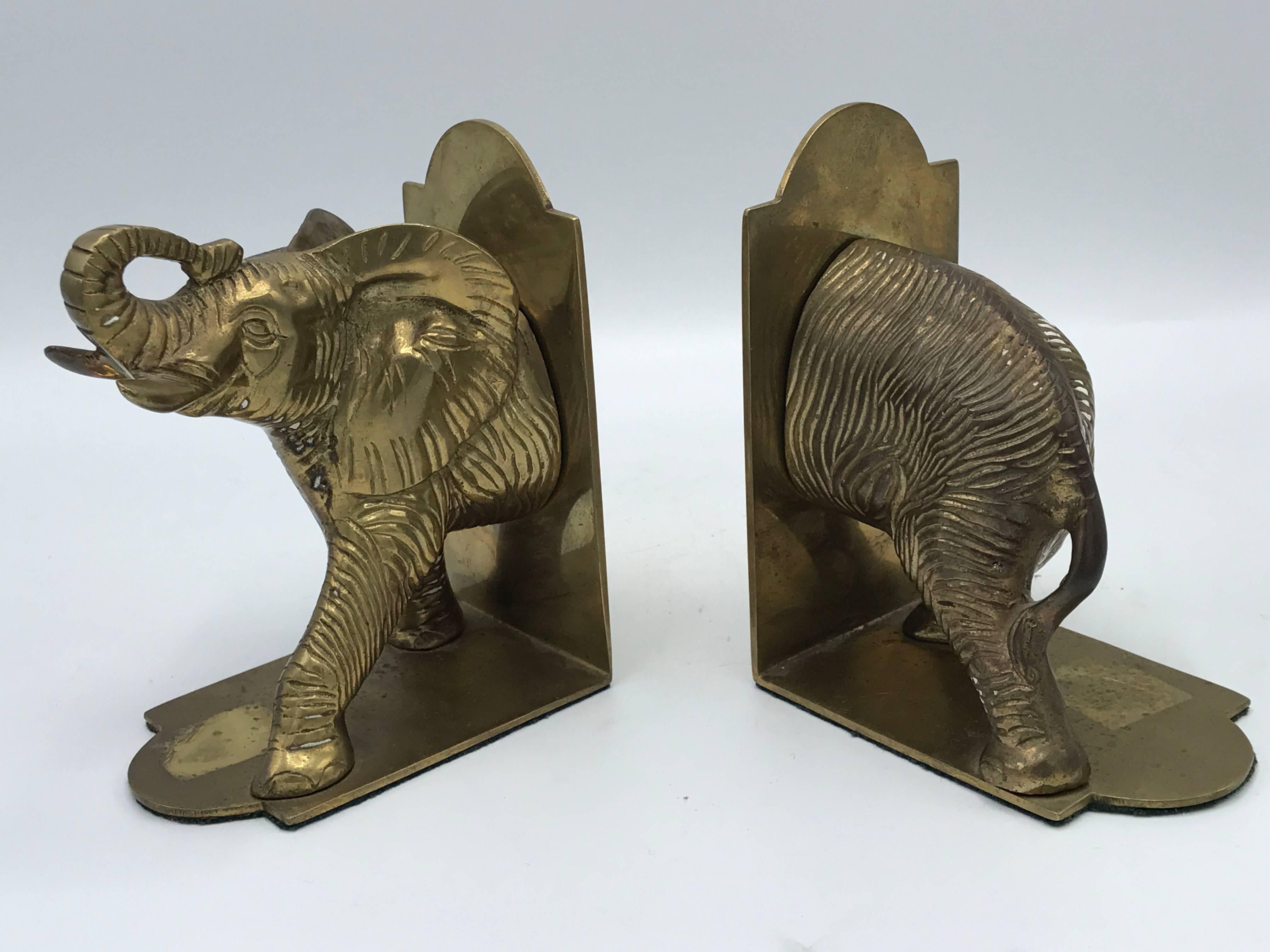 Offered is a stunning pair of 1960s brass elephant sculpture statues.