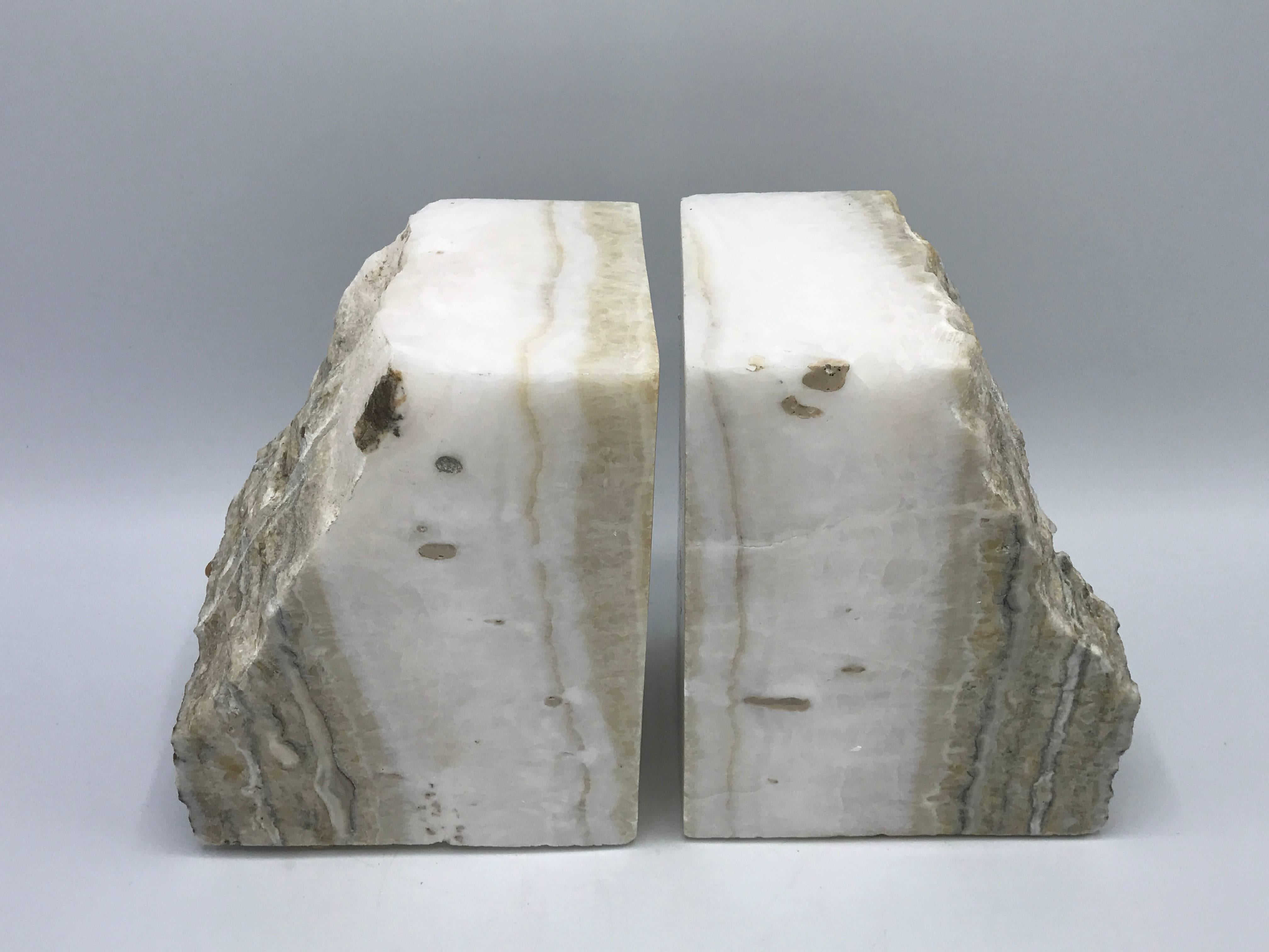 Offered is a gorgeous pair of 1950s white stone bookends. Extremely heavy.