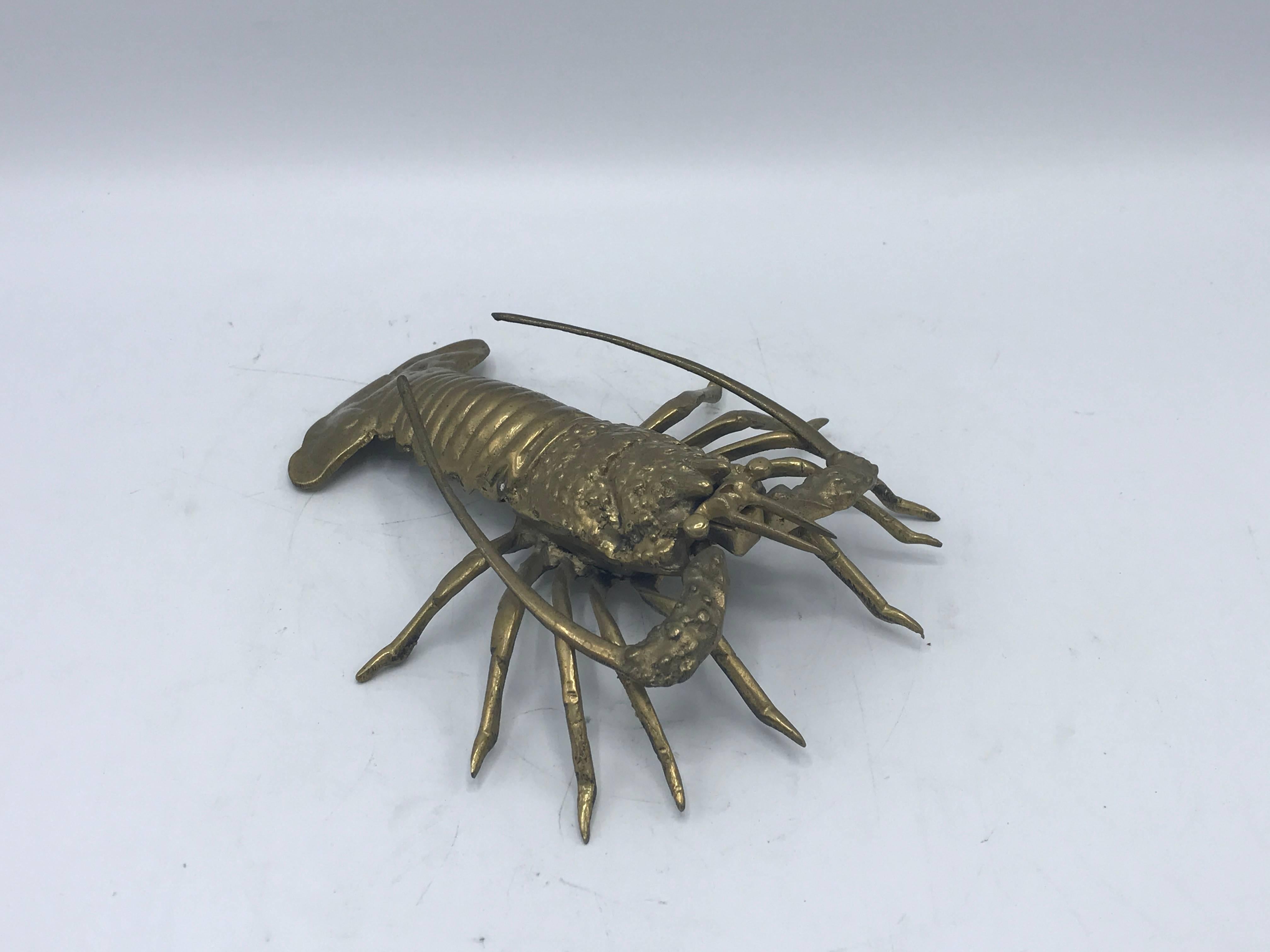 Offered is a beautiful, heavily-detailed, 1960s solid-brass lobster sculpture. Adds a perfect touch of nautical to any room.