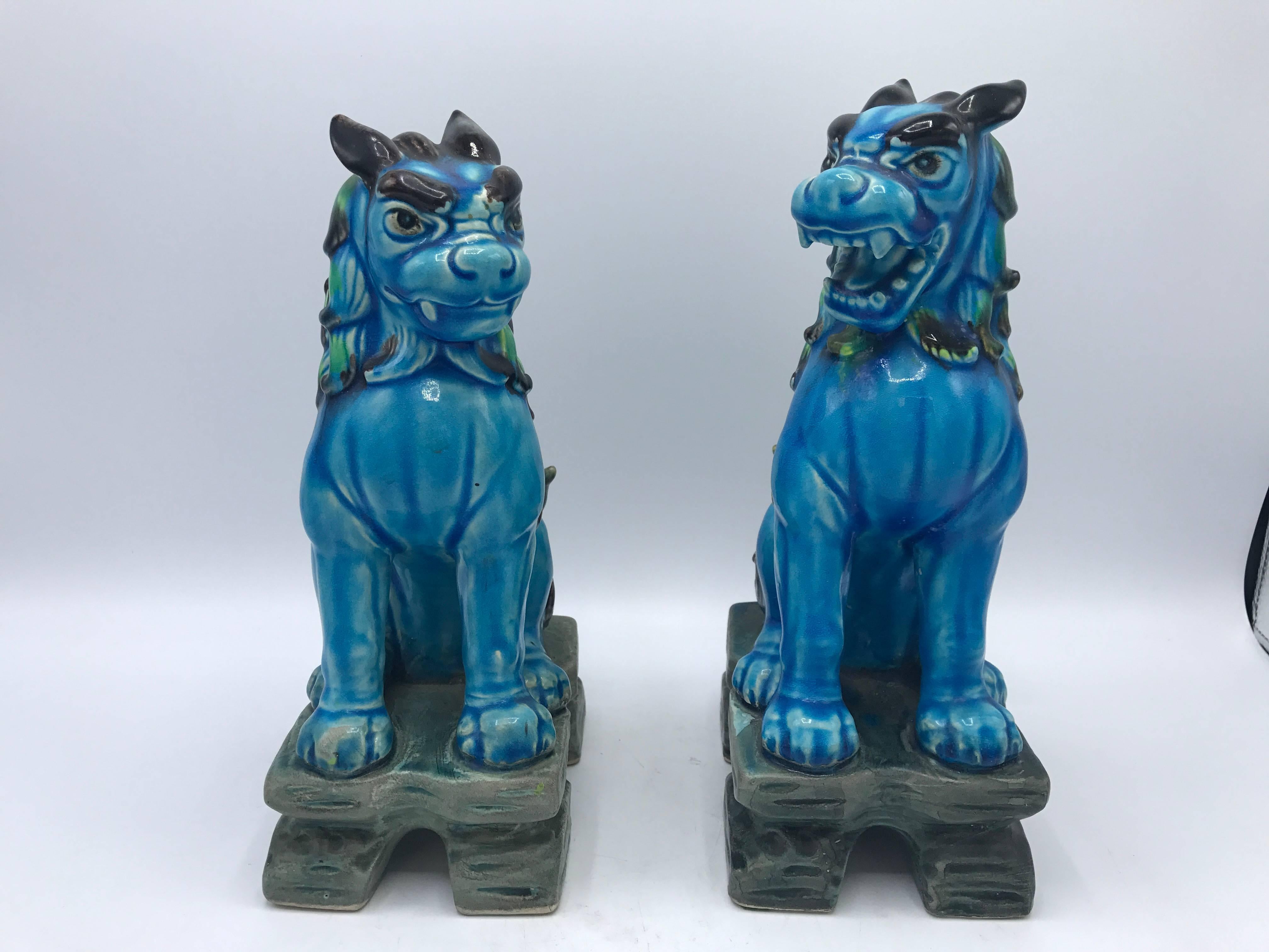 Offered is a gorgeous pair of 1960s polychrome blue and green foo dogs. Marked: Japan. Fairly heavy. 