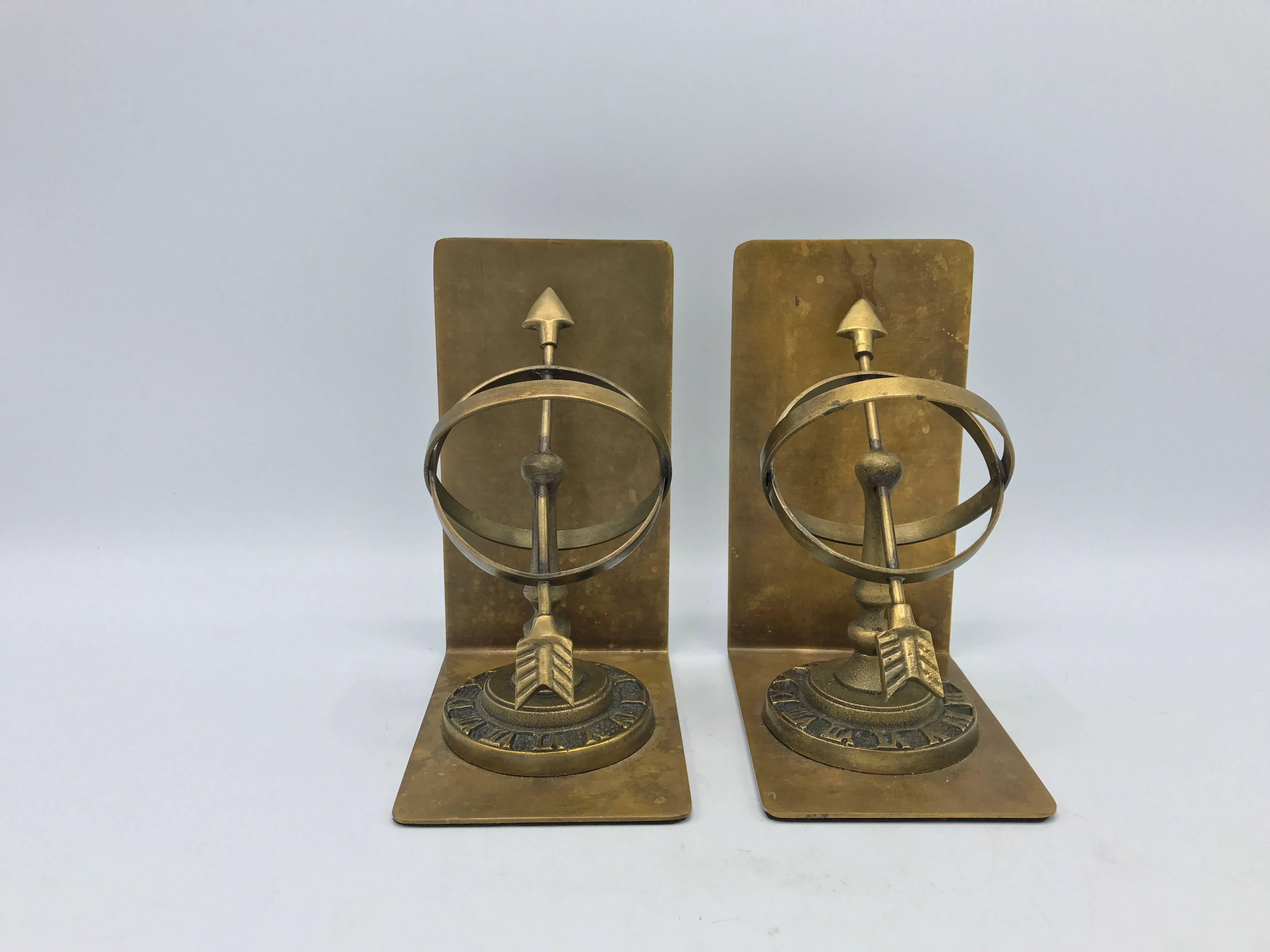 Offered is a gorgeous, pair of 1980s brass armillary bookends. Padded on underside.