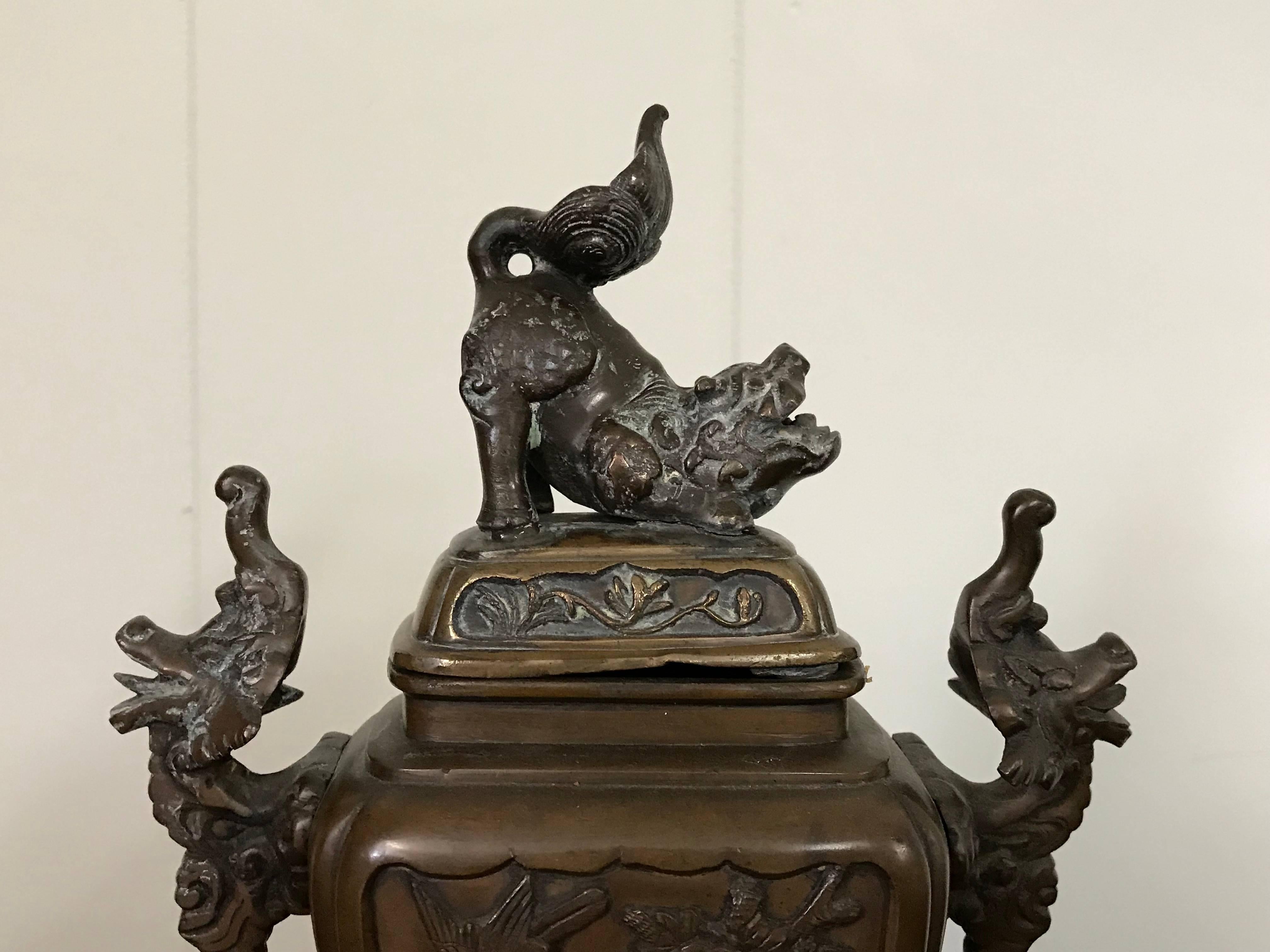Offered is an exquisite, 19th century solid-bronze Asian lidded urn-censor. Detailing of intricate foo dogs and elephant motifs.