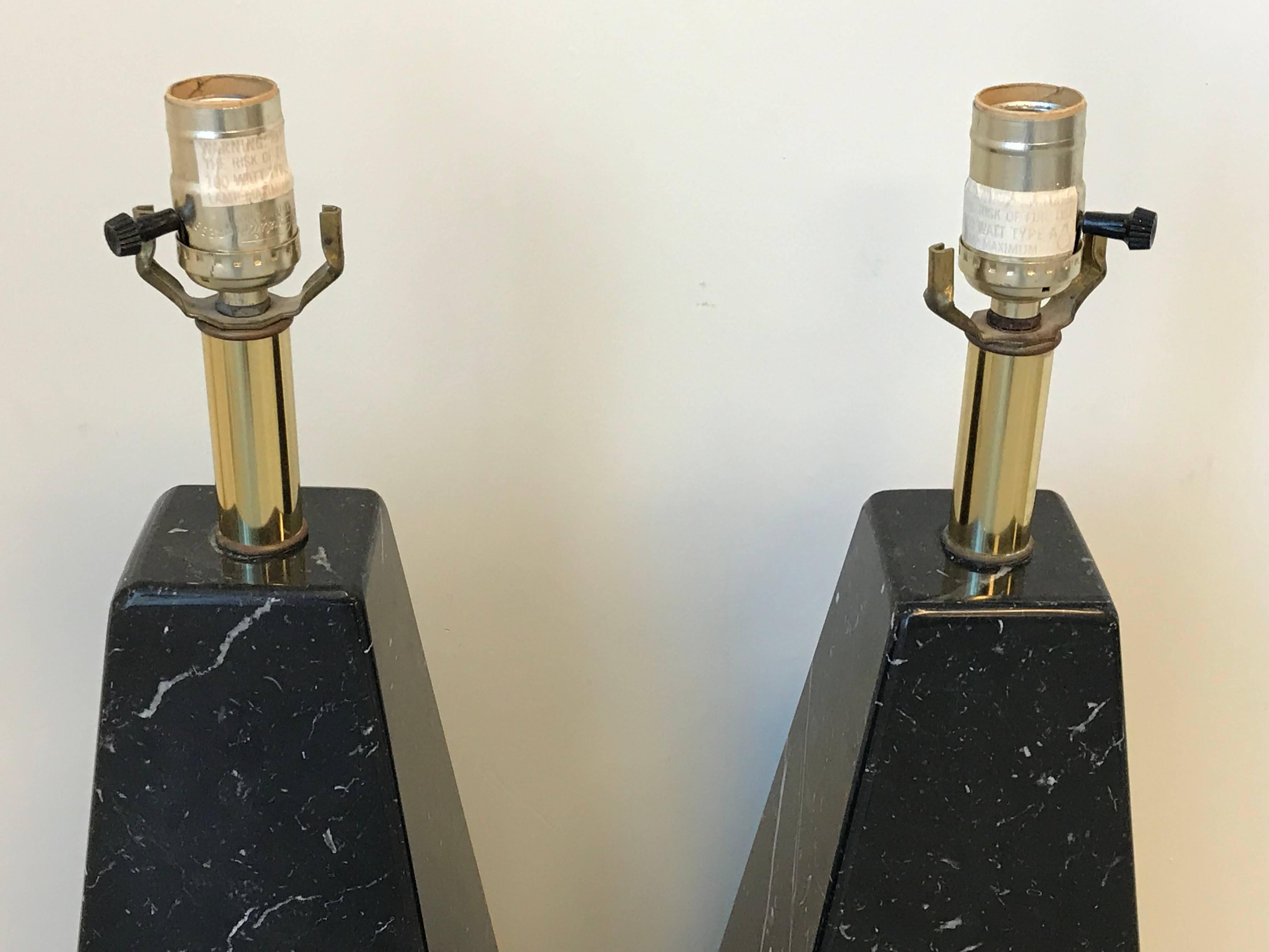 Offered is an exquisite, pair of 1970s Cini Boeri for Arteluce 'Abat Jour' style black marble pyramid lamps. Each lamp has been rewired for US use. Small copper plaques have been applied to backside, near cord, by previous owner, marked with