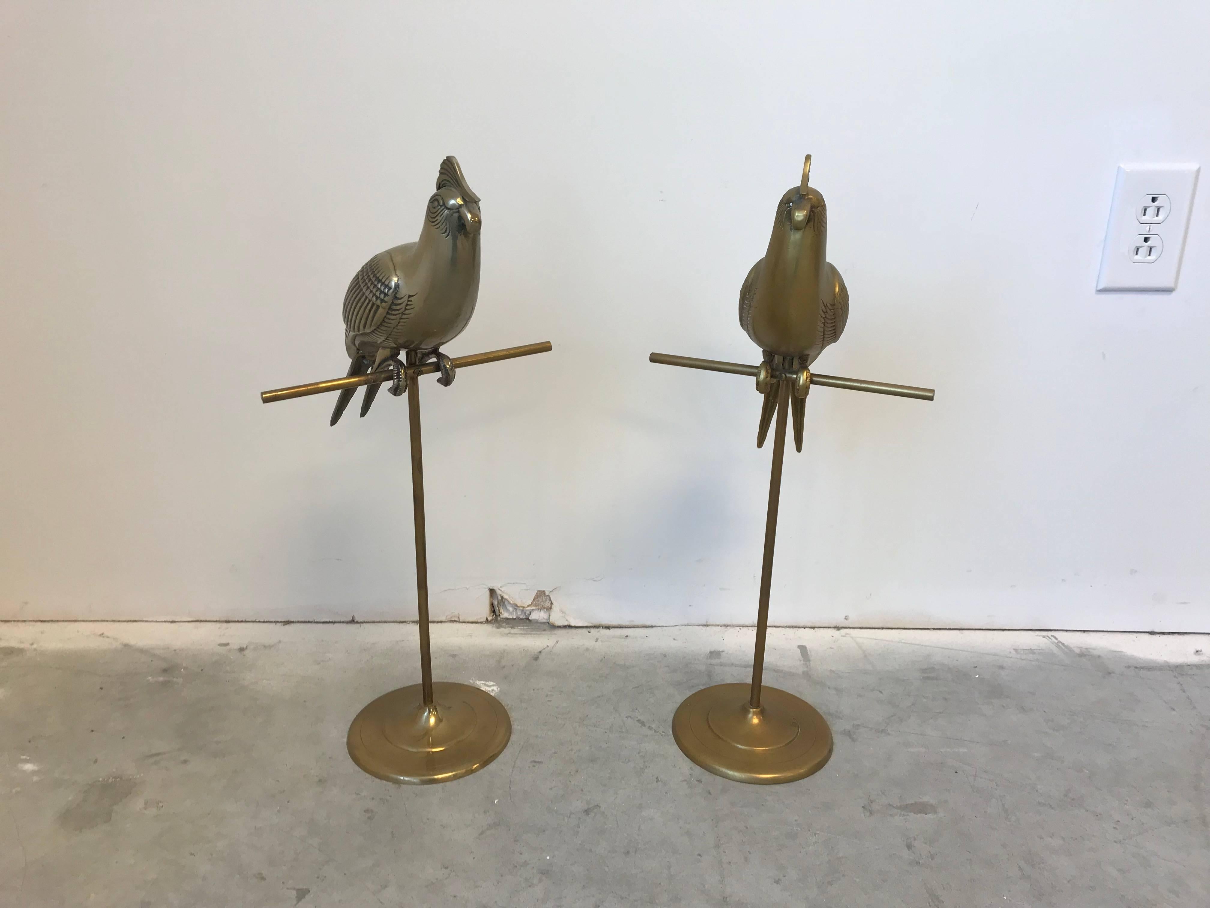 Offered is a beautiful, pair of 1960s Sergio Bustamante style brass cockatiel bird sculptures on a perches.