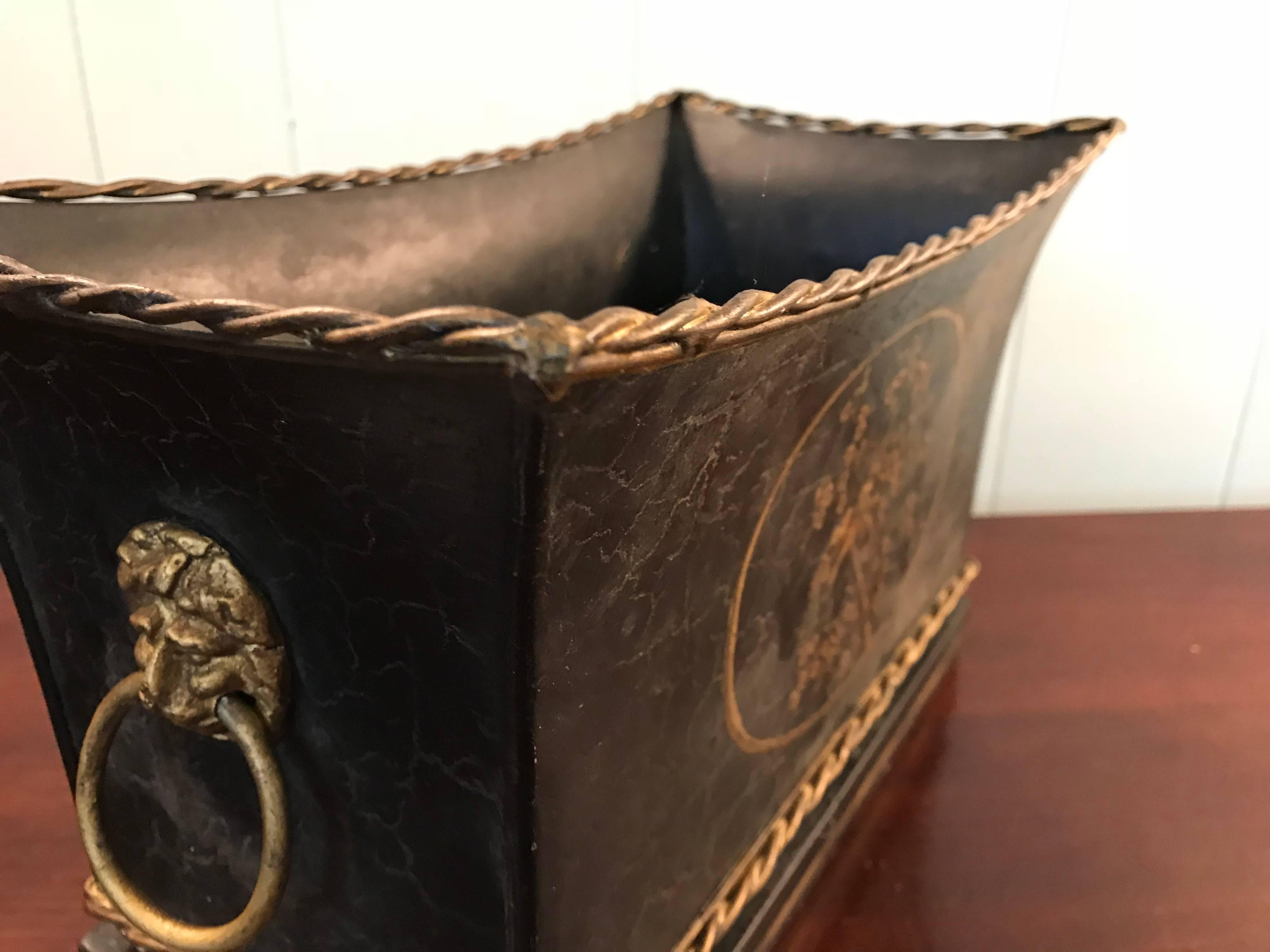 1970s Black and Gold Tole Cachepot with Floral Motif and Lion Head Handles In Good Condition In Richmond, VA