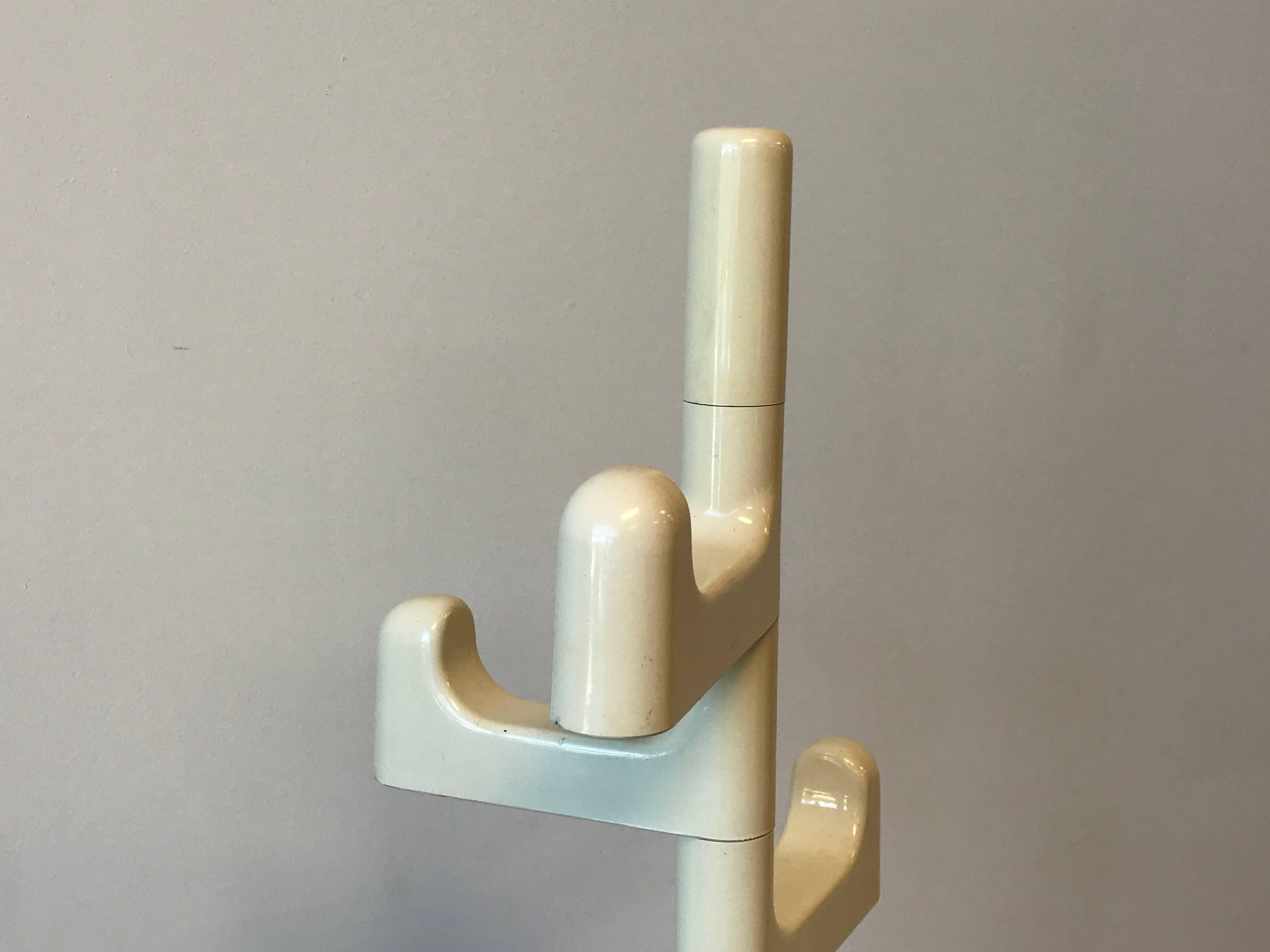 Offered is a modern and sophisticated, 1960s Italian white-plastic and metal coat rack by Makio Hasuike. Weighted base. Large arms are adjustable, small arms are fixed. Large arm measures 15.5