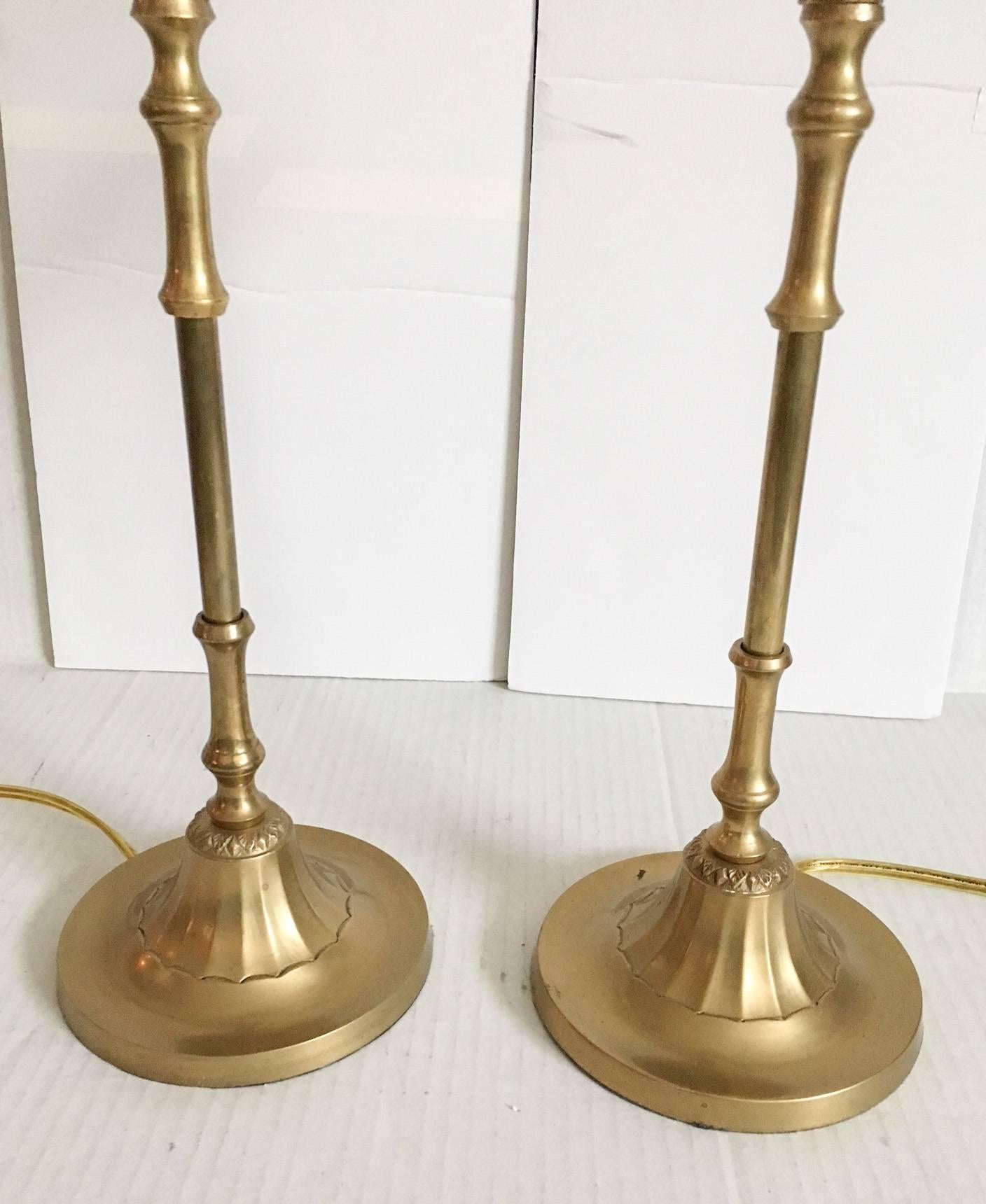 Beyond fabulous pair of solid brass candlestick buffet lamps with faux-bamboo form stems and a graceful palm tree topper. Each lamp has the original wiring and is in excellent vintage condition with light age patina. Dimensions for each lamp,