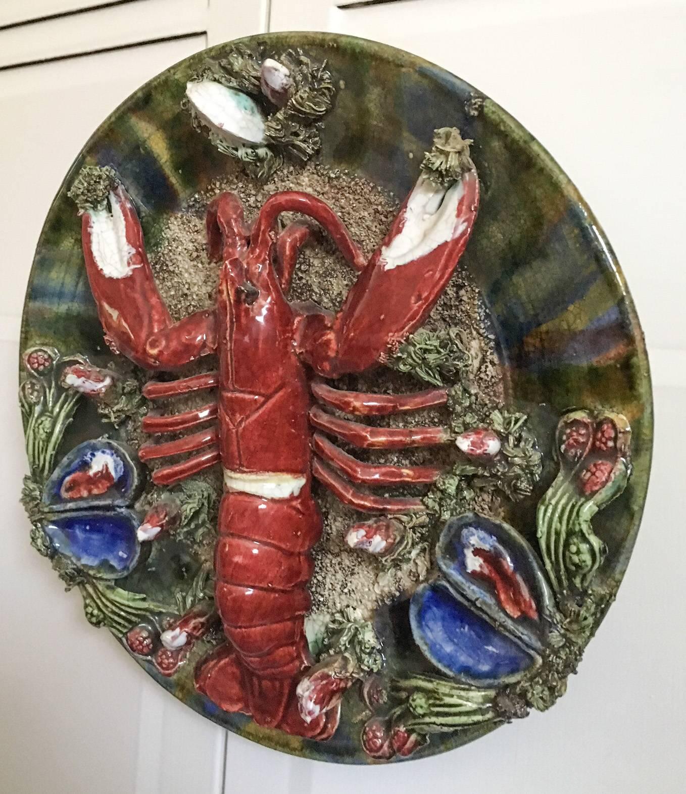 Incredibly detailed Majolica-style Portugese Pallisy wall plaque by ceramist Jose a Cunha of Caldas de Rainha, Portugal. The plaque has the Cunha embossed glove-shaped impressed mark on the verso as shown. Wall platter is decorated in rich