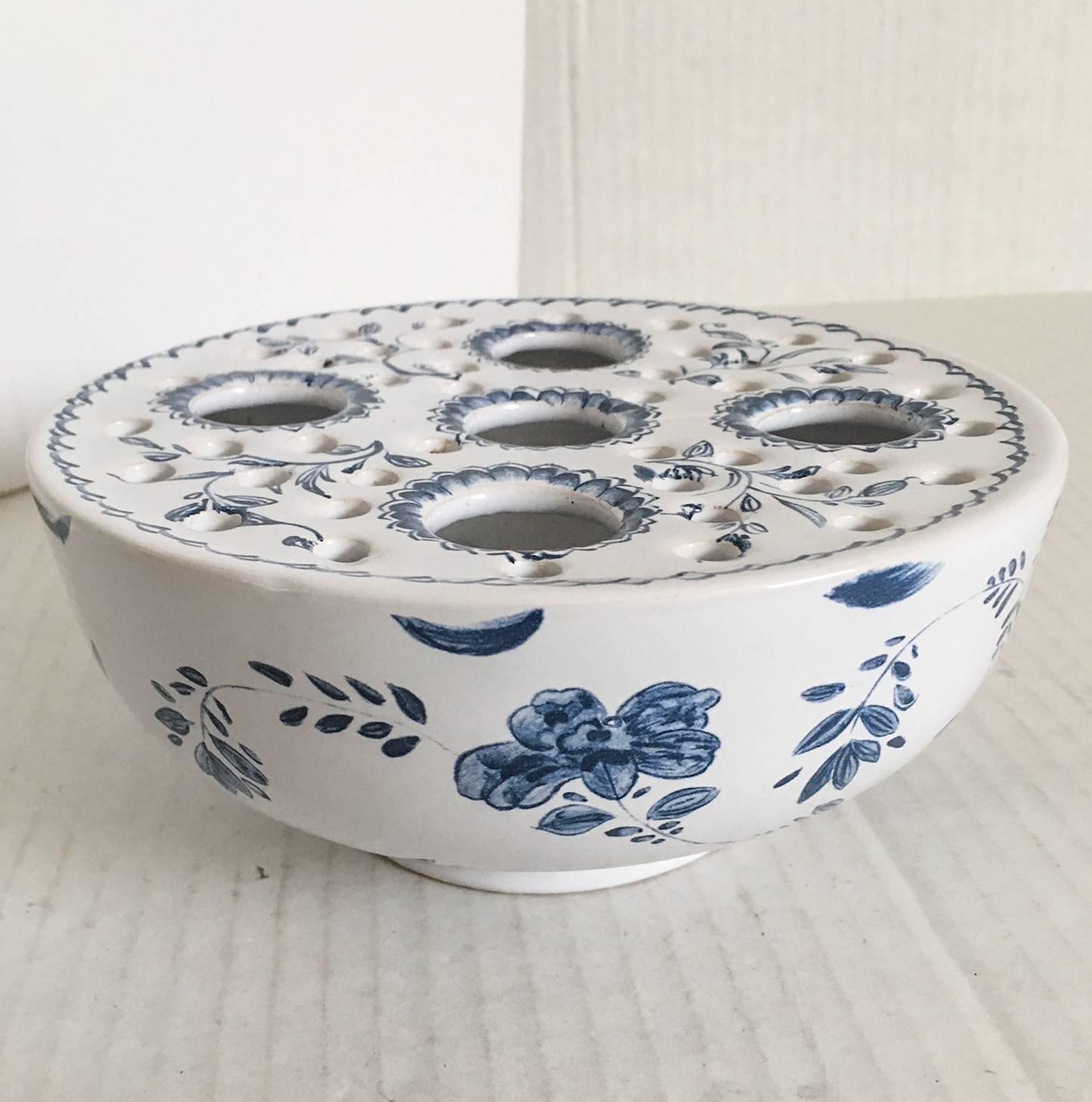 Wonderful glazed ceramic delft-style flower frog by Mottahedeh for the Metropolitan Museum of Art. There are two lines in the glaze from the manufacturing process and are not repaired cracks; please see photographs before purchasing. Excellent