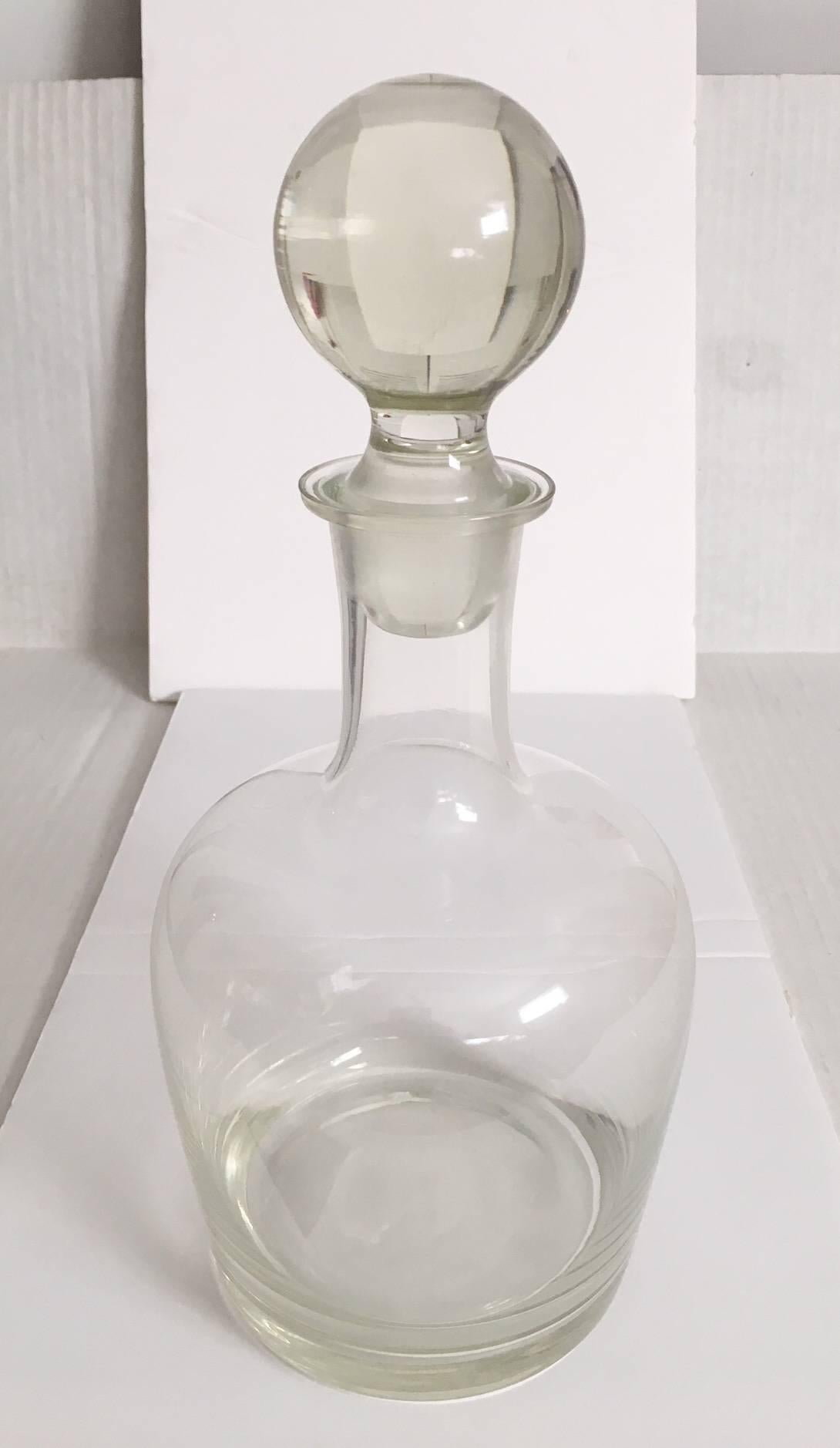 Elegant blown crystal glass decanter by Tiffany and Company, marked with an acid etched mark on the base. Excellent as-found condition with light age spotting inside the bottom which is not noticeable when filled with liquid.