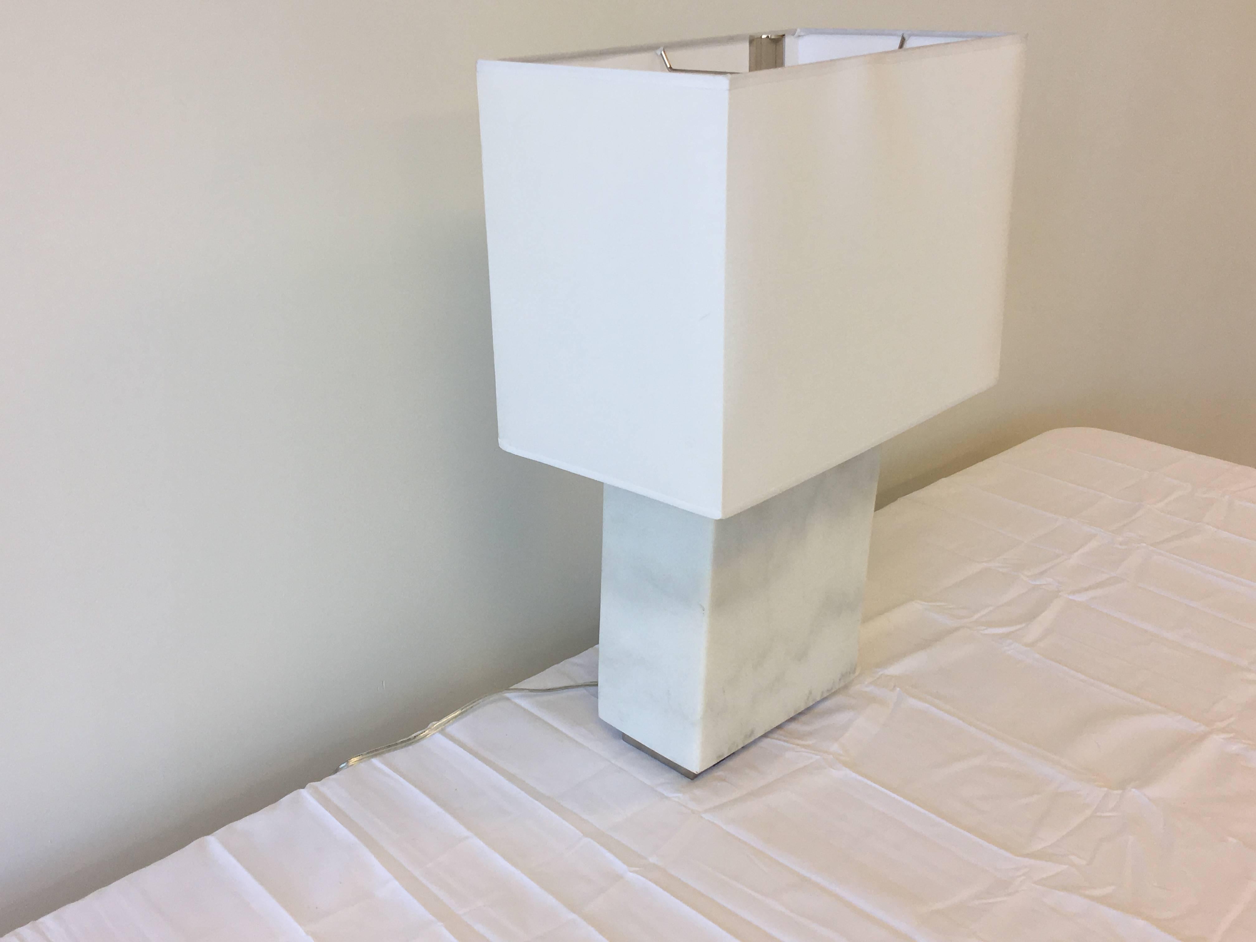 Offered is a fabulous, modern white marble and chrome Ralph Lauren lamp. The base is a solid white marble and chrome. Includes pure white, rectangular lampshade and chrome finial.

Marked: 