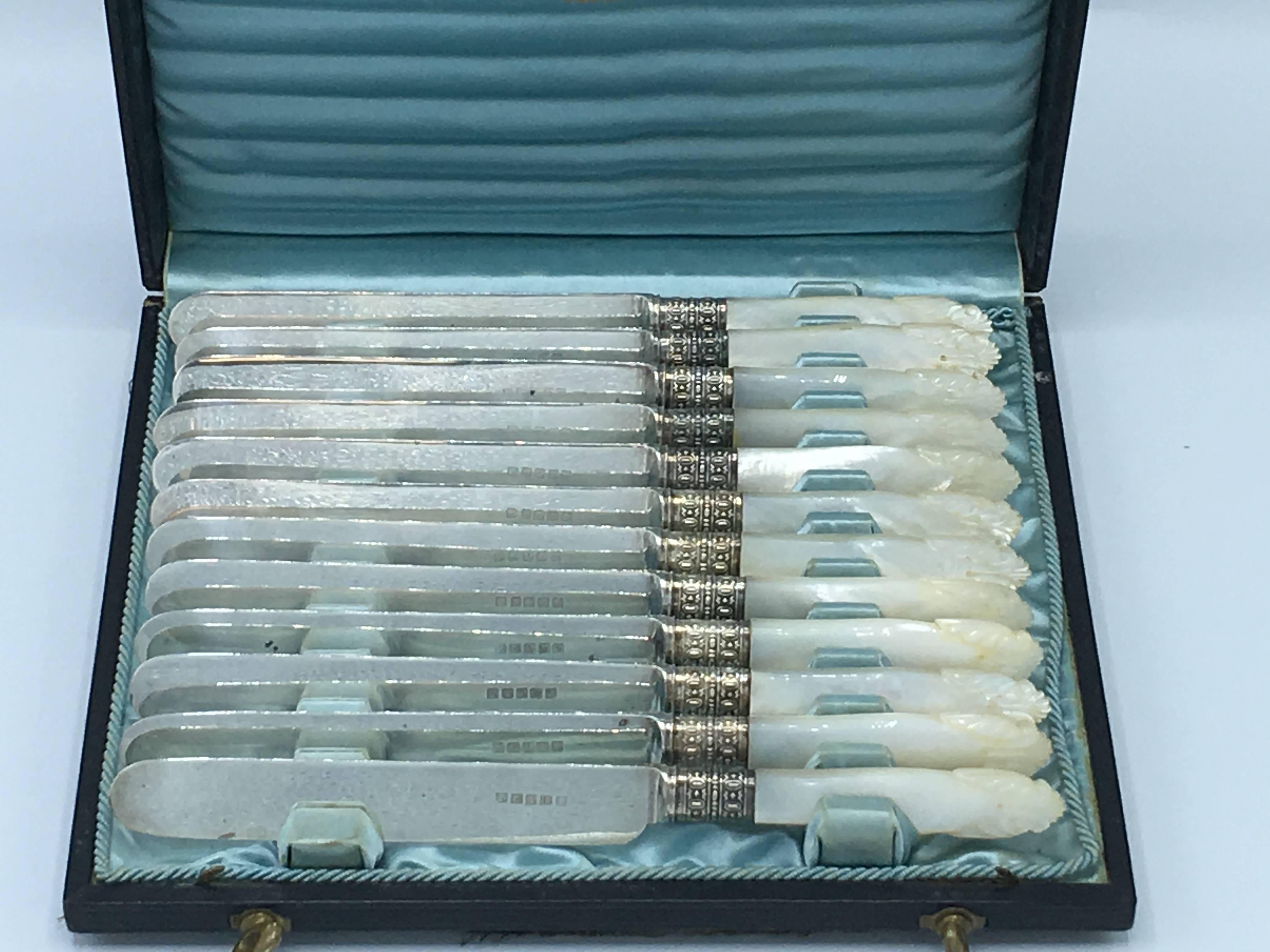 Offered is an absolutely immaculate, 19th century Tiffany & Co., set of 12, sterling silver and mother-of-pearl knives. Marked, Tiffany "Sterling Silver, K." The set includes the original box, with functioning locking mechanism. 

Each
