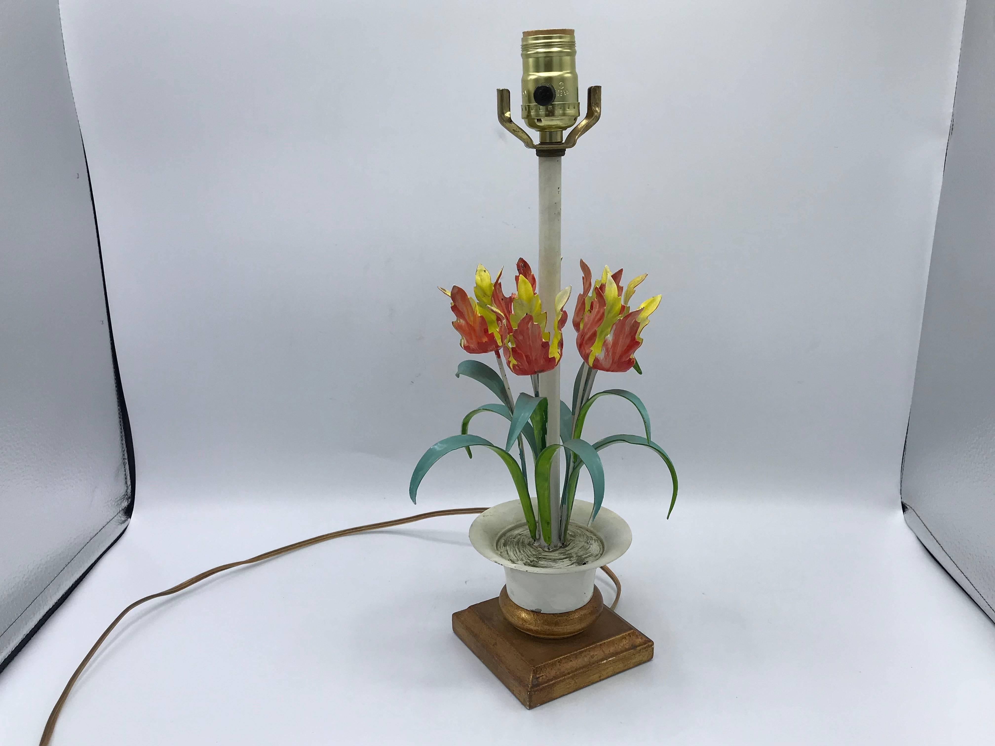 Offered is a stunning, 1970s Italian hand-painted tole tulip lamp. The piece is mounted on a gilded Florentine base.