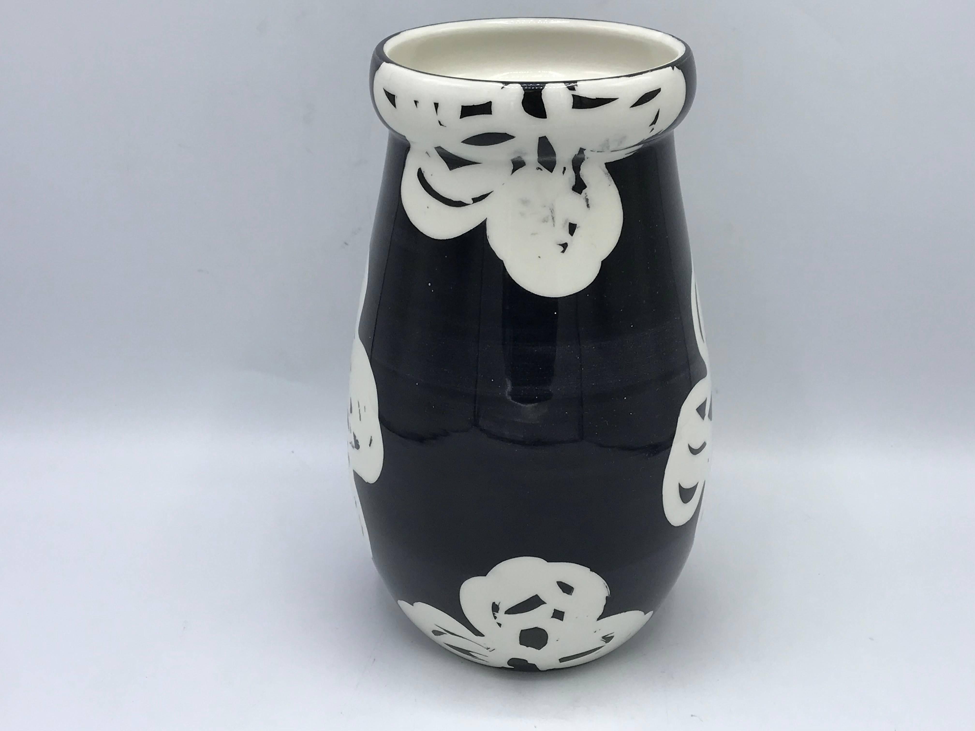 Offered is a beautiful, 1970s Bitossi vase with a modern black and white, abstract floral motif.