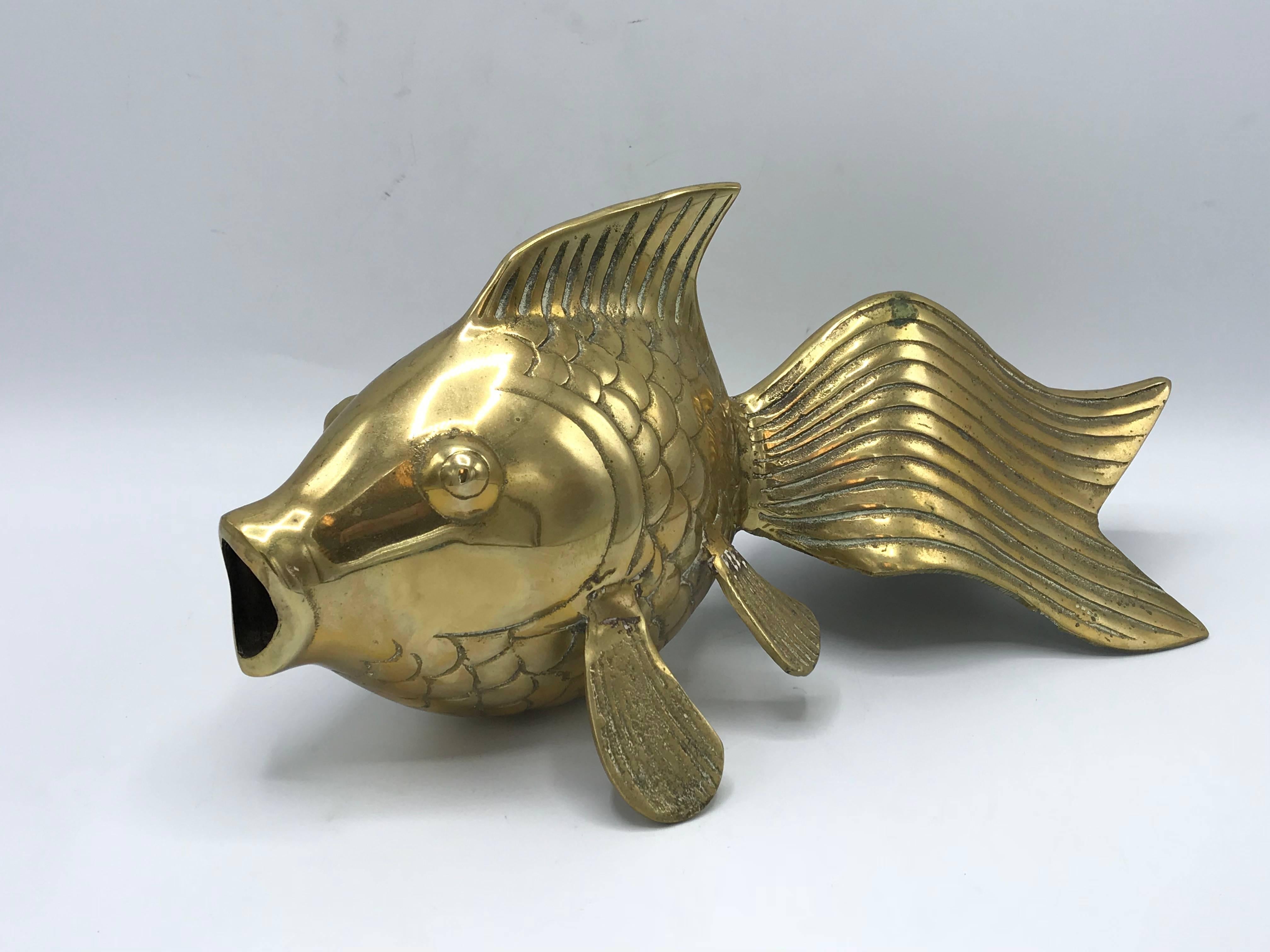 Offered is a beautiful, large, 1970s modern brass koi fish sculpture. Lovely detailing allover. Heavy, weighing 3.10lbs.