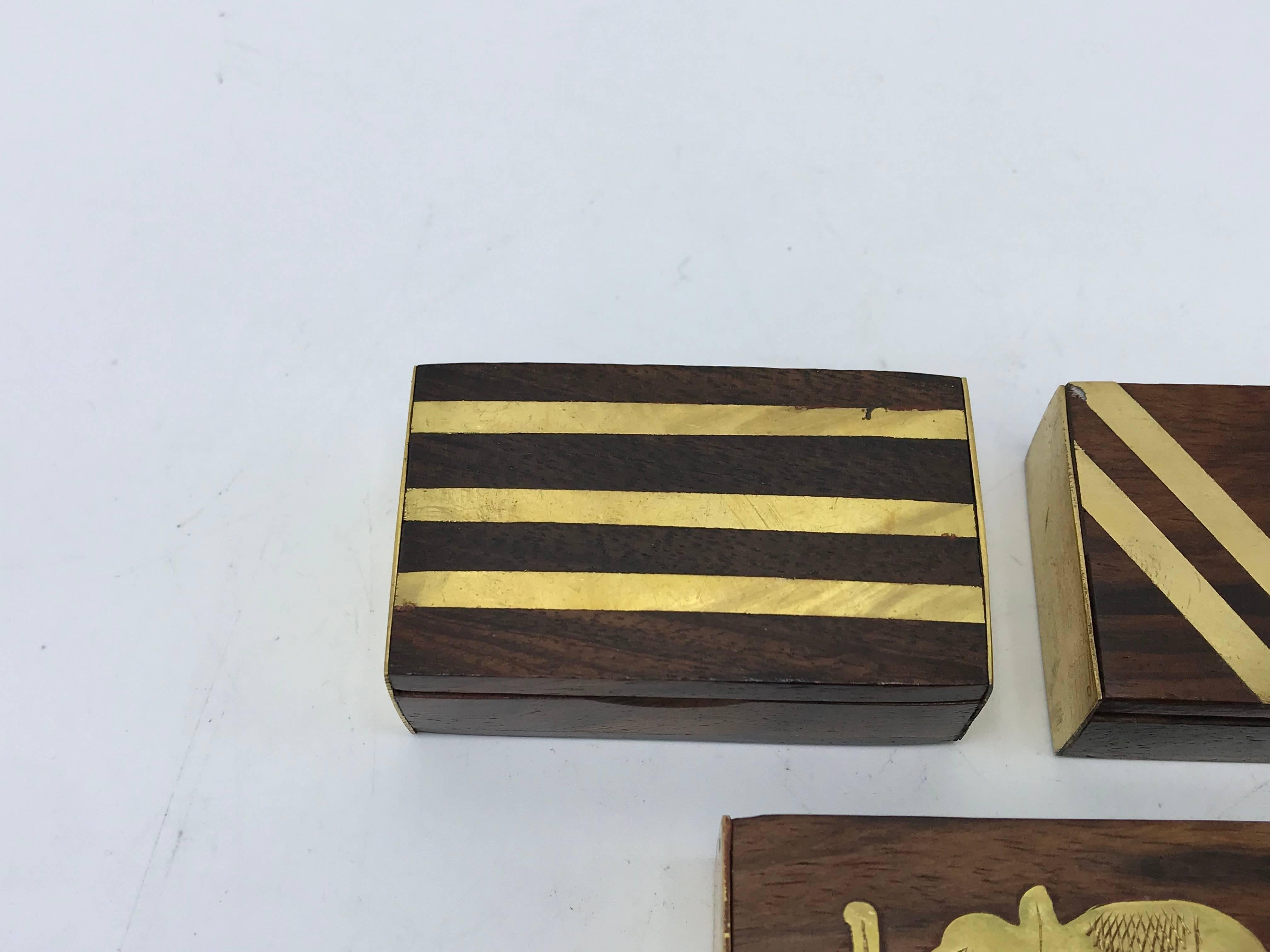 Offered is a stunning, set of three, 1960s modern teak and brass inlay matchboxes. Gradual sizing, please see photo 5 and 6.

 