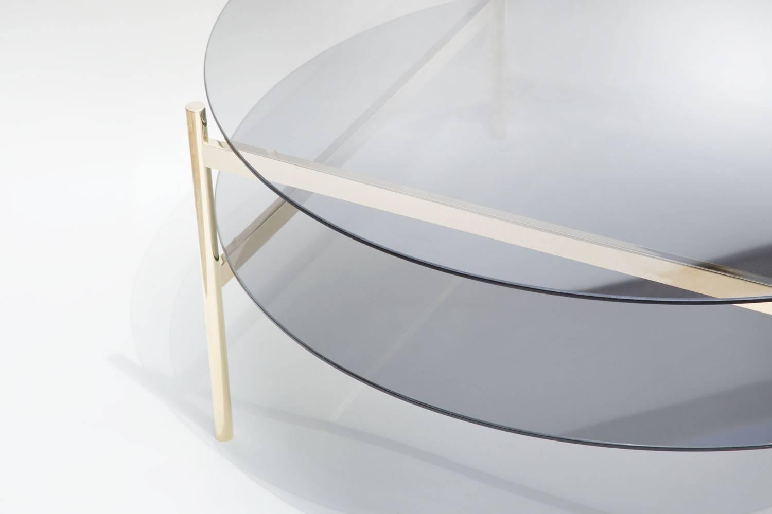 Made to order. Please allow 6 weeks for production.

Brass Frame / Smoked Glass / Smoked Glass

The Duotone Furniture series is based on a modular hardware system that pairs sturdy construction with visual lightness and a range of potential