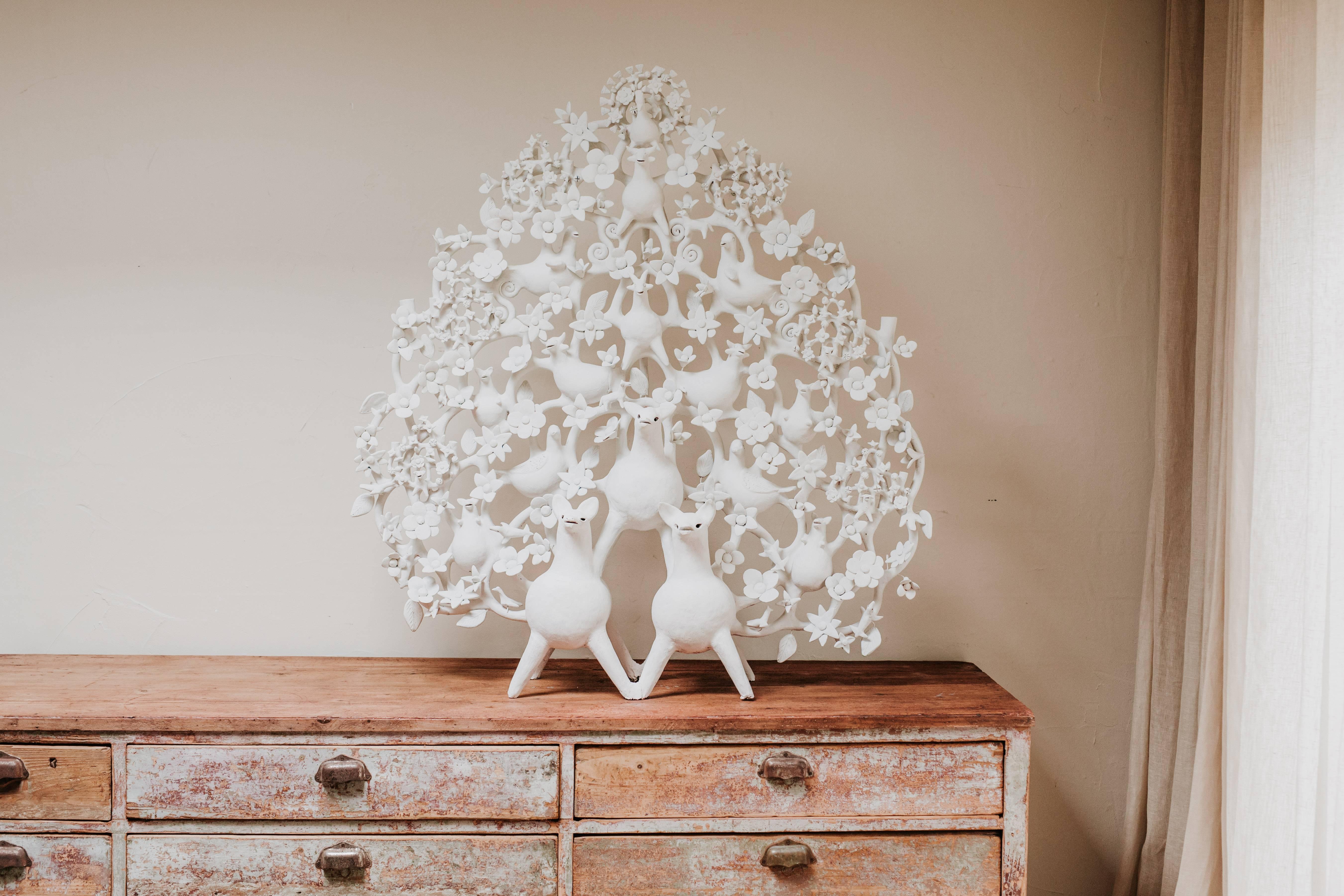 This is a terra cotta tree of life out of the ordinary object.