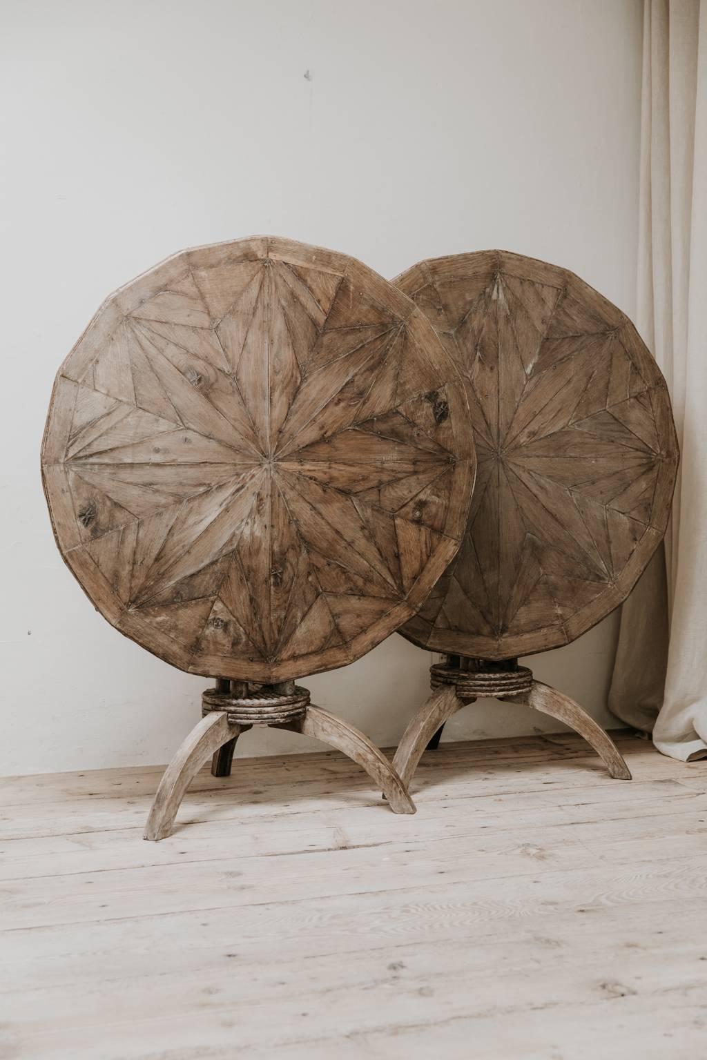 A stunning pair of 16 sided starburst oak and twig tables, fine cabinetmaking, lovely patina, measures: 100 cm wide x 76 cm high and 130 cm high when tilt-top lift up