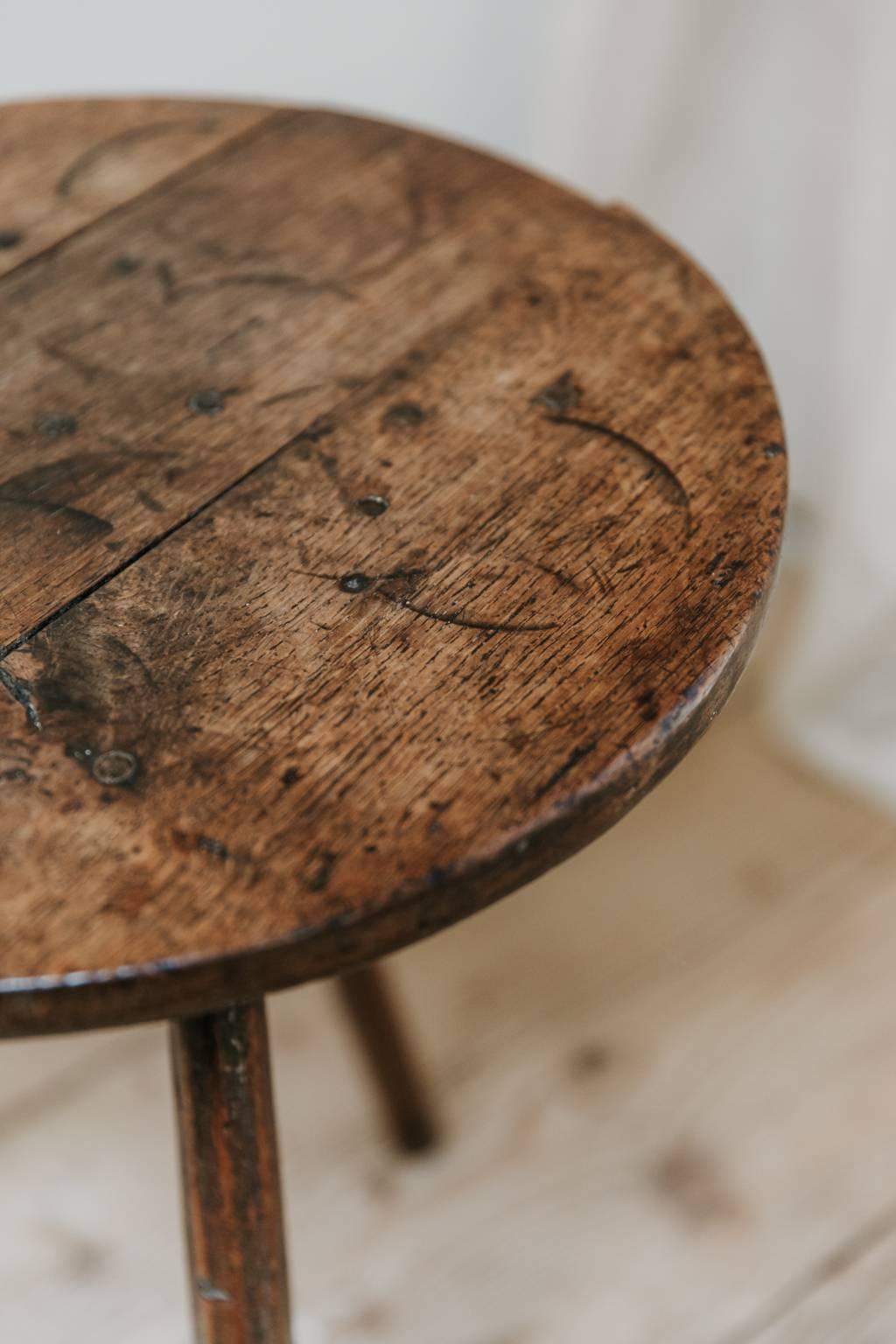 This is a small quirky oak cricket table, sublime patina, simple lines, made in the UK/West Country during the 18th century, great in every interior.