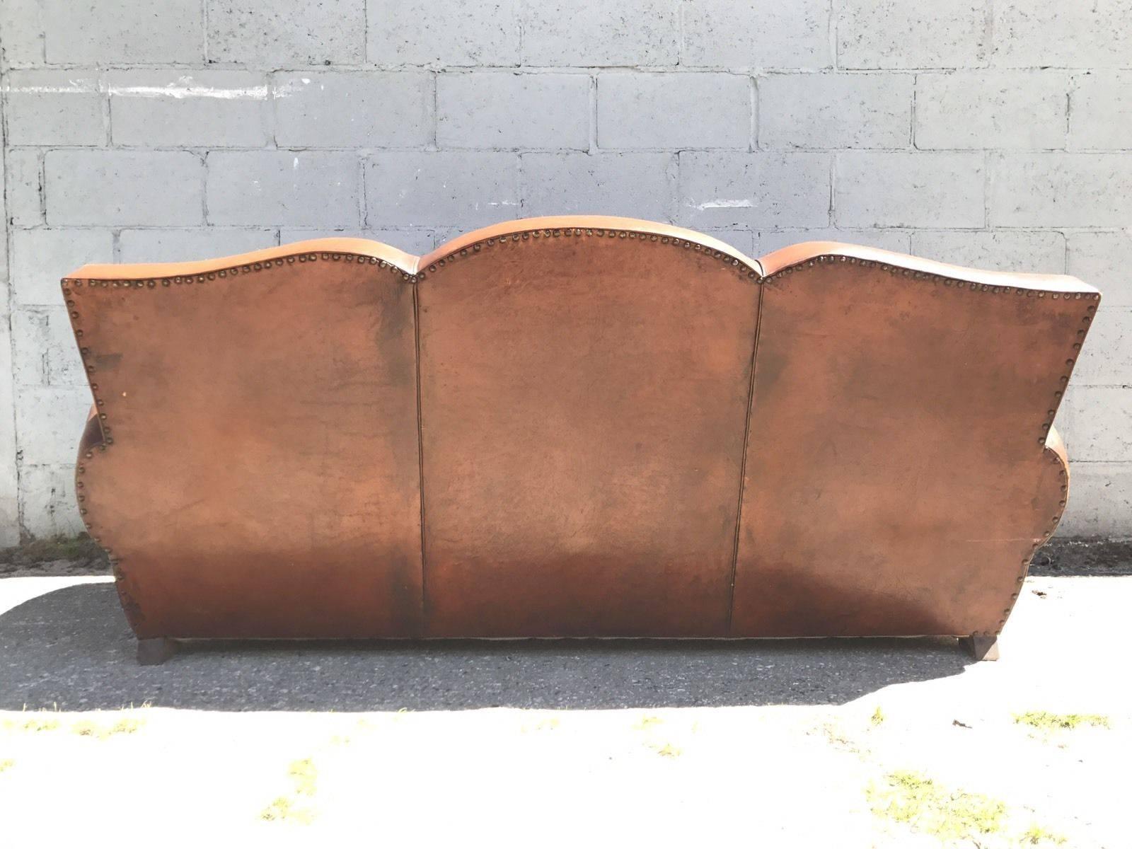 Here we have a beautiful French leather club sofa from the very early 1900s. Being a three-seat and not a sofa bed, this is a very rare find! In fantastic worn condition, but free of any holes or tares.

Becoming increasingly hard to find in