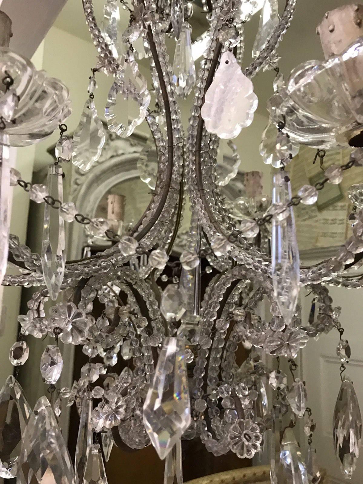 This is a beautiful French chandelier, dated circa 1890s. 

Hundreds of crystal beads decorate the whole structure. 

Made from solid bronze with 100s of crystal drops, this gives off amazing light. 

Approximate 80 cm x 50 cm. 

Check out