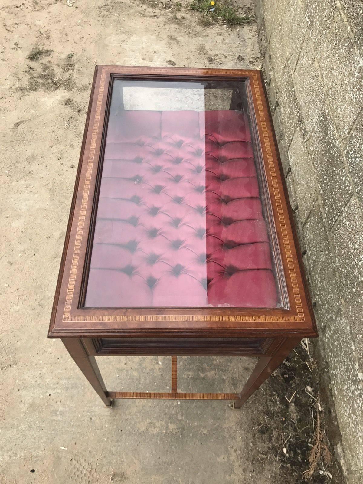 Here we have a very unusual display case, cabinet. It's has a flap on top opening up into the novelty buttoned silk. U

Dimensions: 82cm wide, 82cm tall, 50cm deep.

 

 