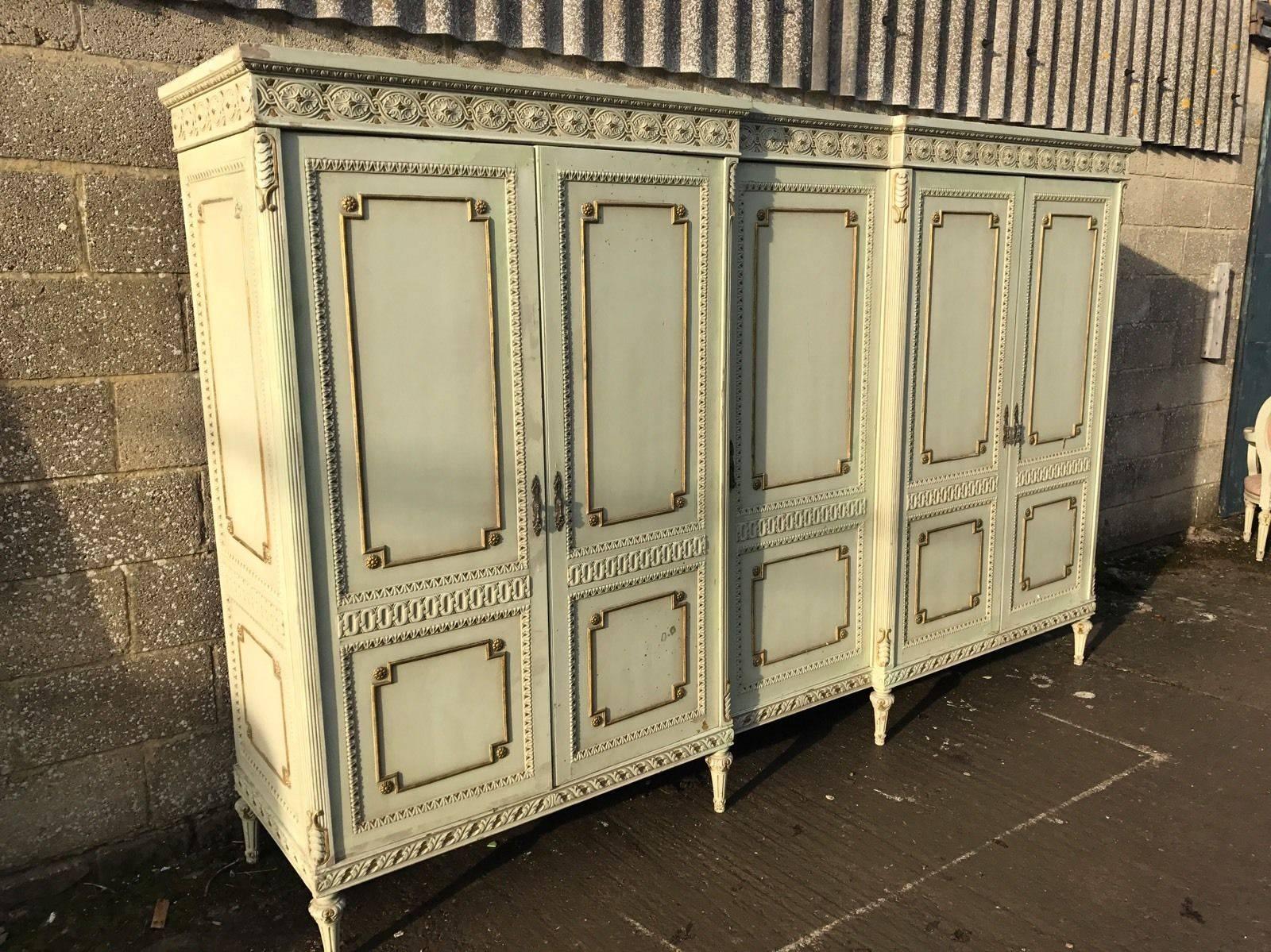 This is a very rare five-door French armoire. Very hard to come by, rarely seen for sale anywhere.

With its original paint and original floral paint work, it really is a one off. 

Splits down in to several sections for ease of