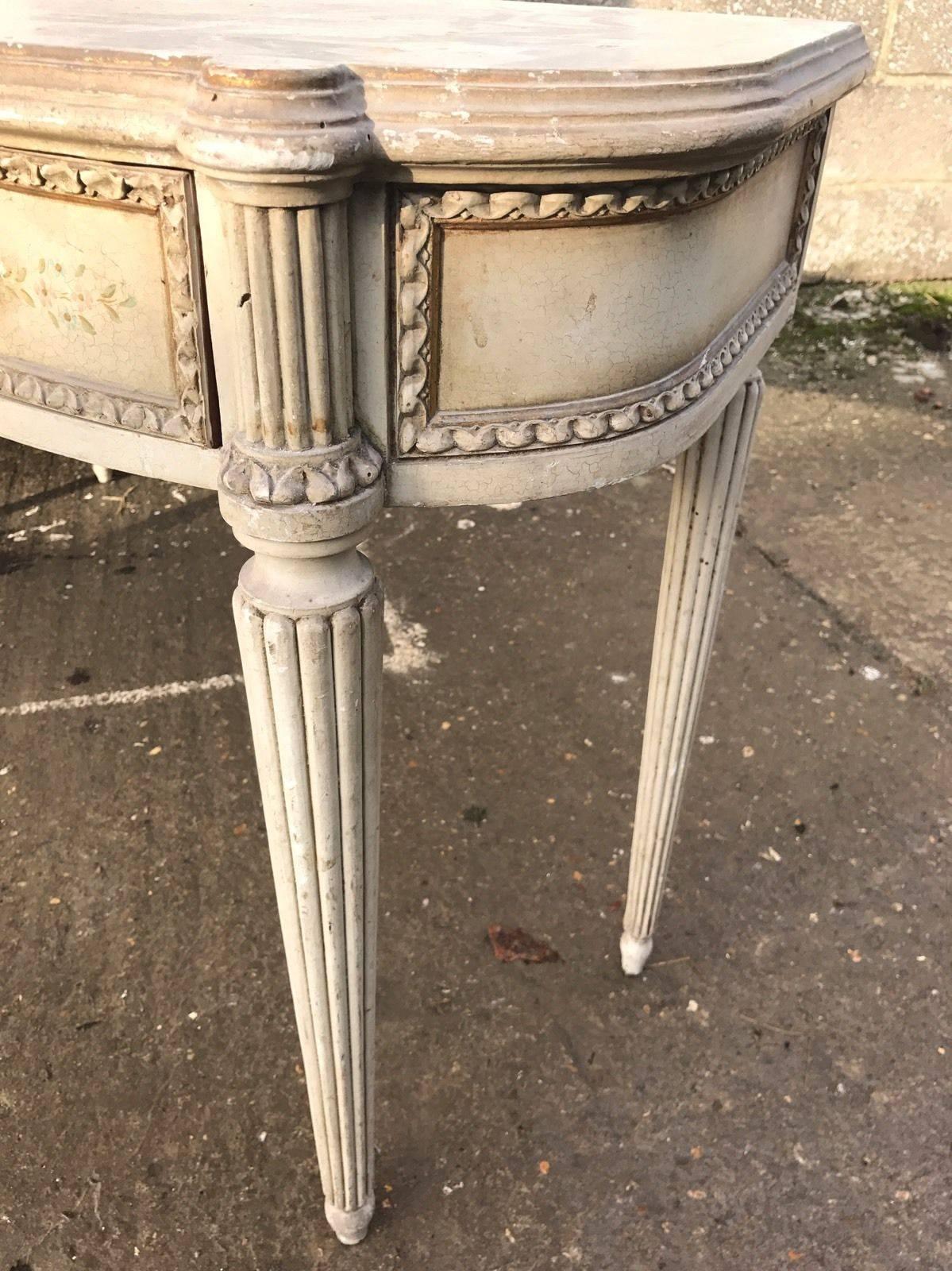 This is a beautiful and original, French console or dressing table complete with three drawers. Lovely shape, in its original shabby distressed condition.
Dimensions- 135cm wide, 72cm high, 41cm deep.



 