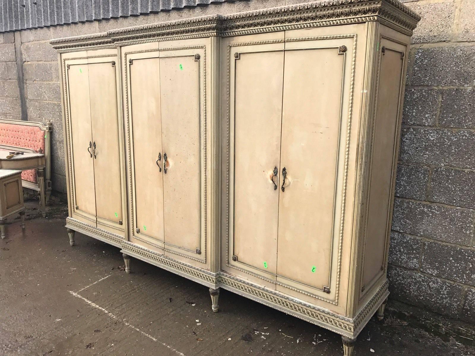 This is a very rare six-door French armoire. Very hard to come by, rarely seen for sale anywhere.

With its original paint and original floral paint work, it really is a one off. 

Splits down in to several sections for ease of