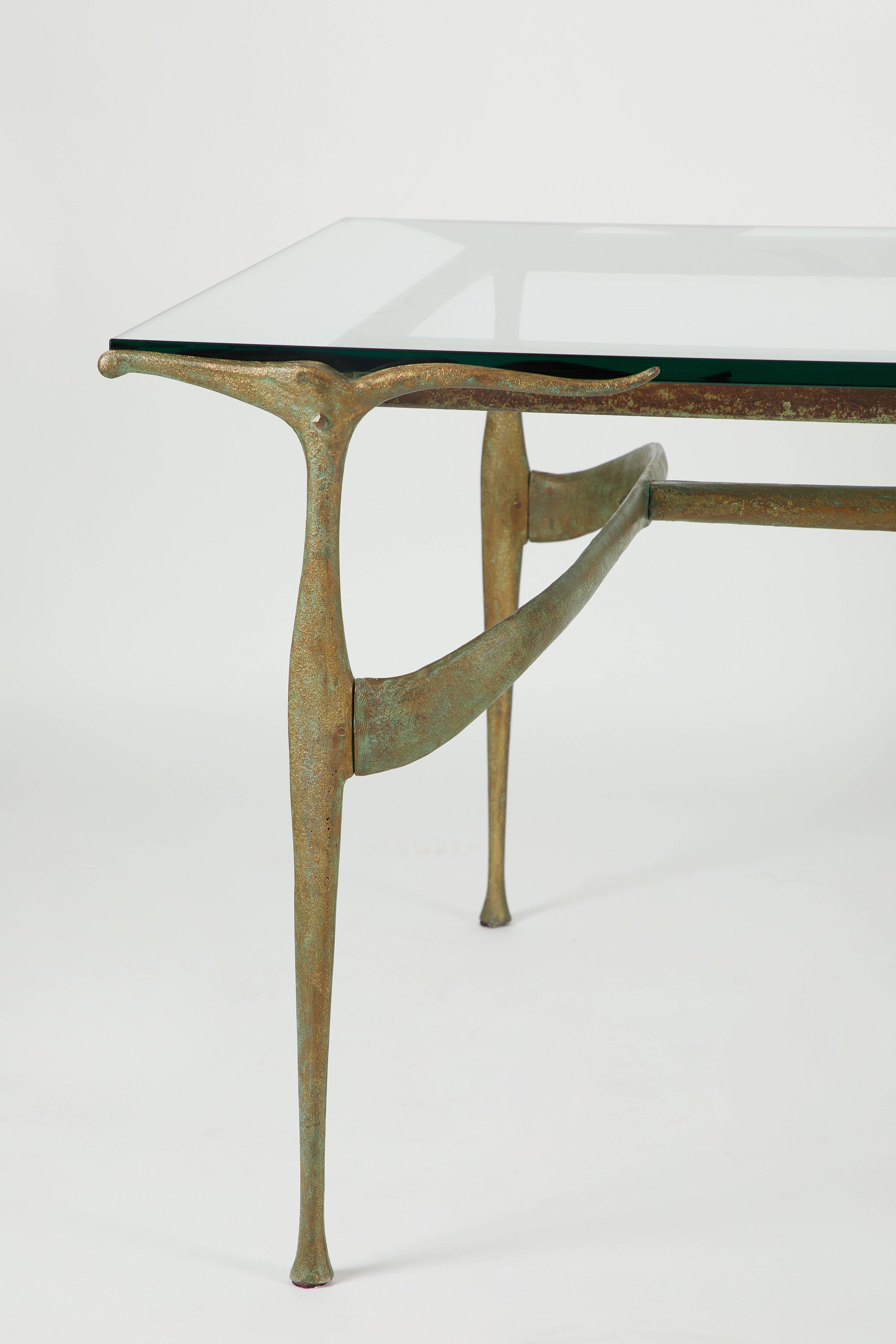 Iconic sculptural dining table designed by Don Johnson Studio, 1956. New glass top. A matching set of eight Gazelle dining chairs also available.