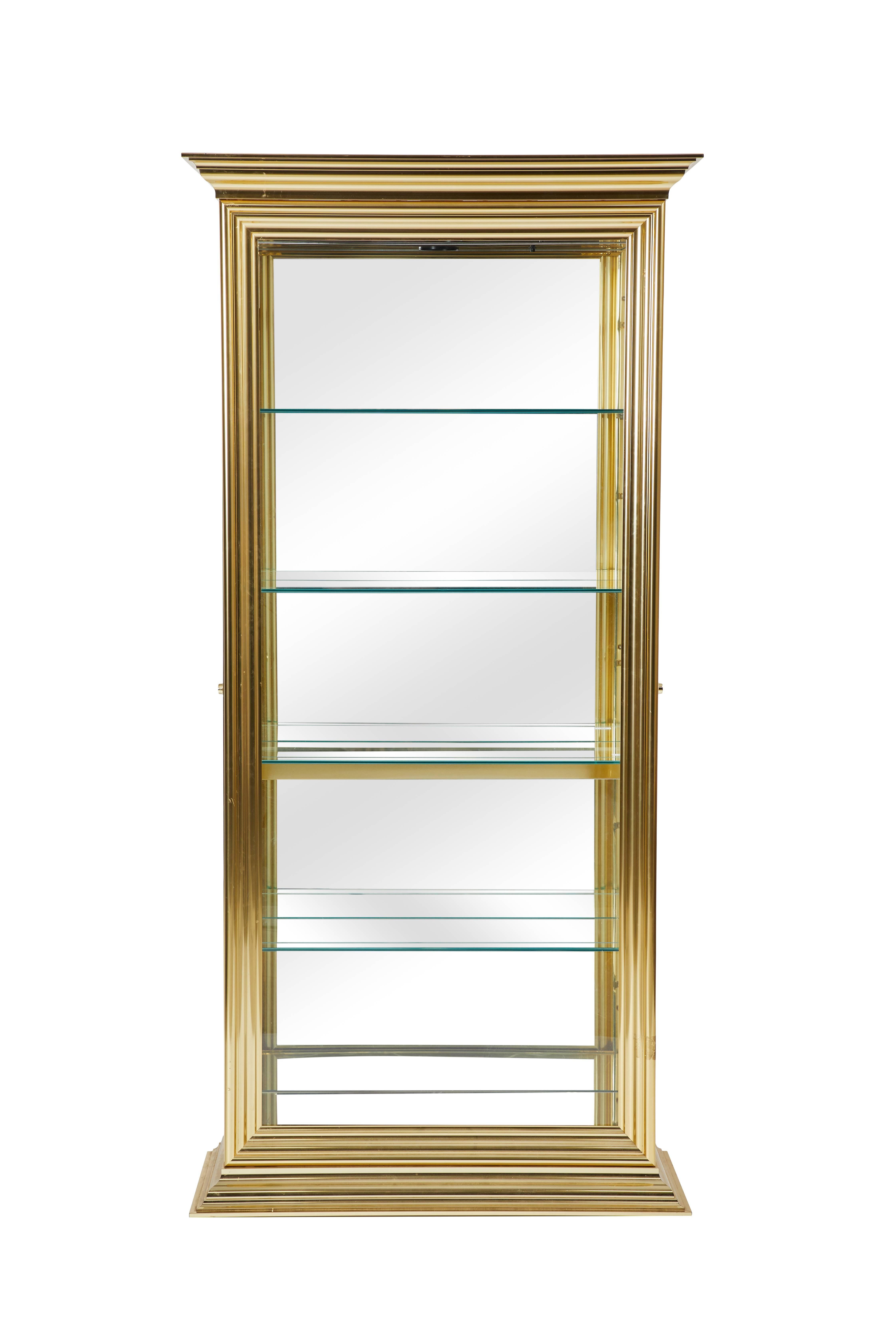 Brass and glass display cabinet in the style of Mastercraft.