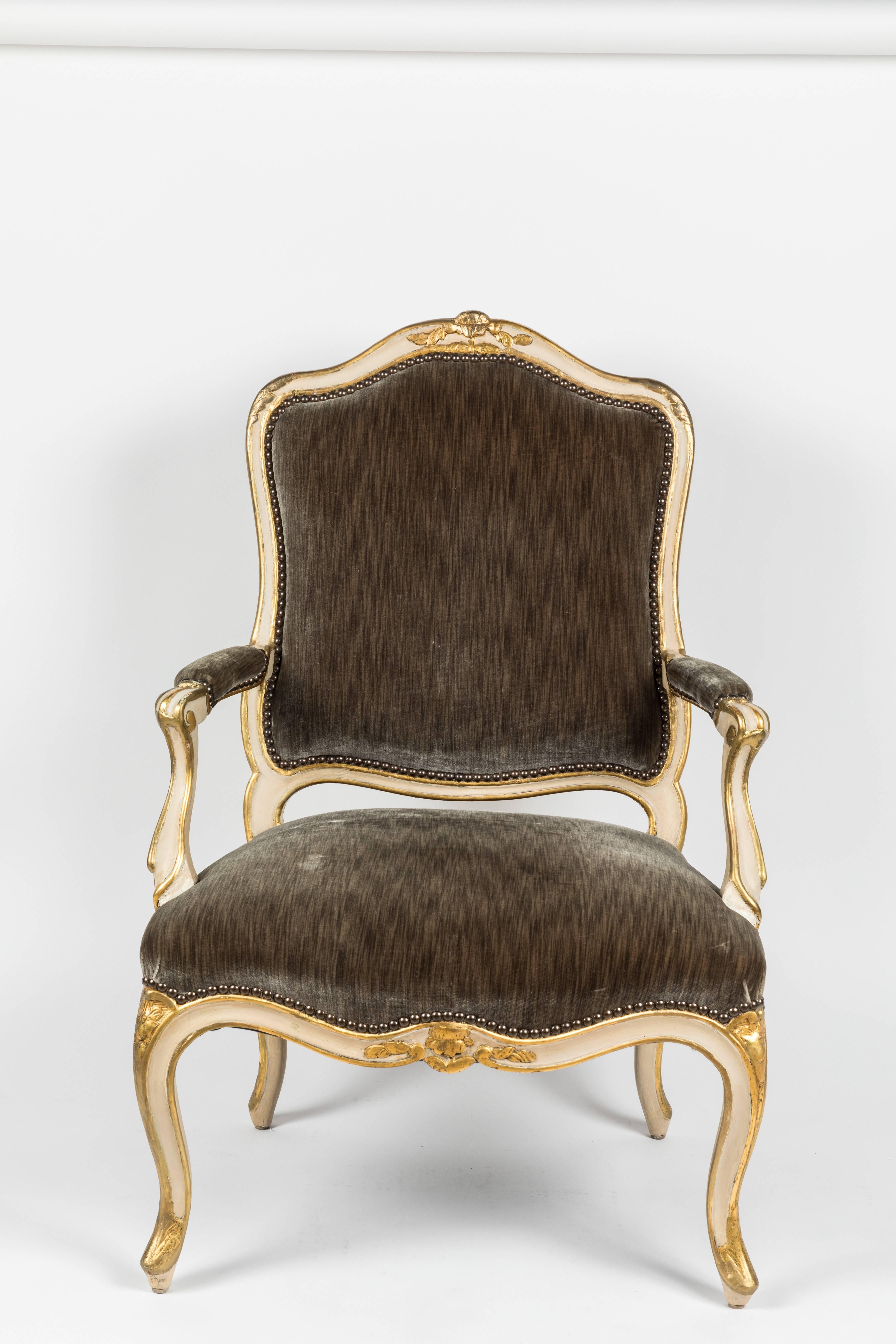 Antique fauteuil armchair in the Louis XV style. Polychrome and partial-giltwood frame. French, 19th century. Formerly in the collection of Iris and Gerald Cantor, Bel Air. Newly re-upholstered in charcoal silk velvet.
