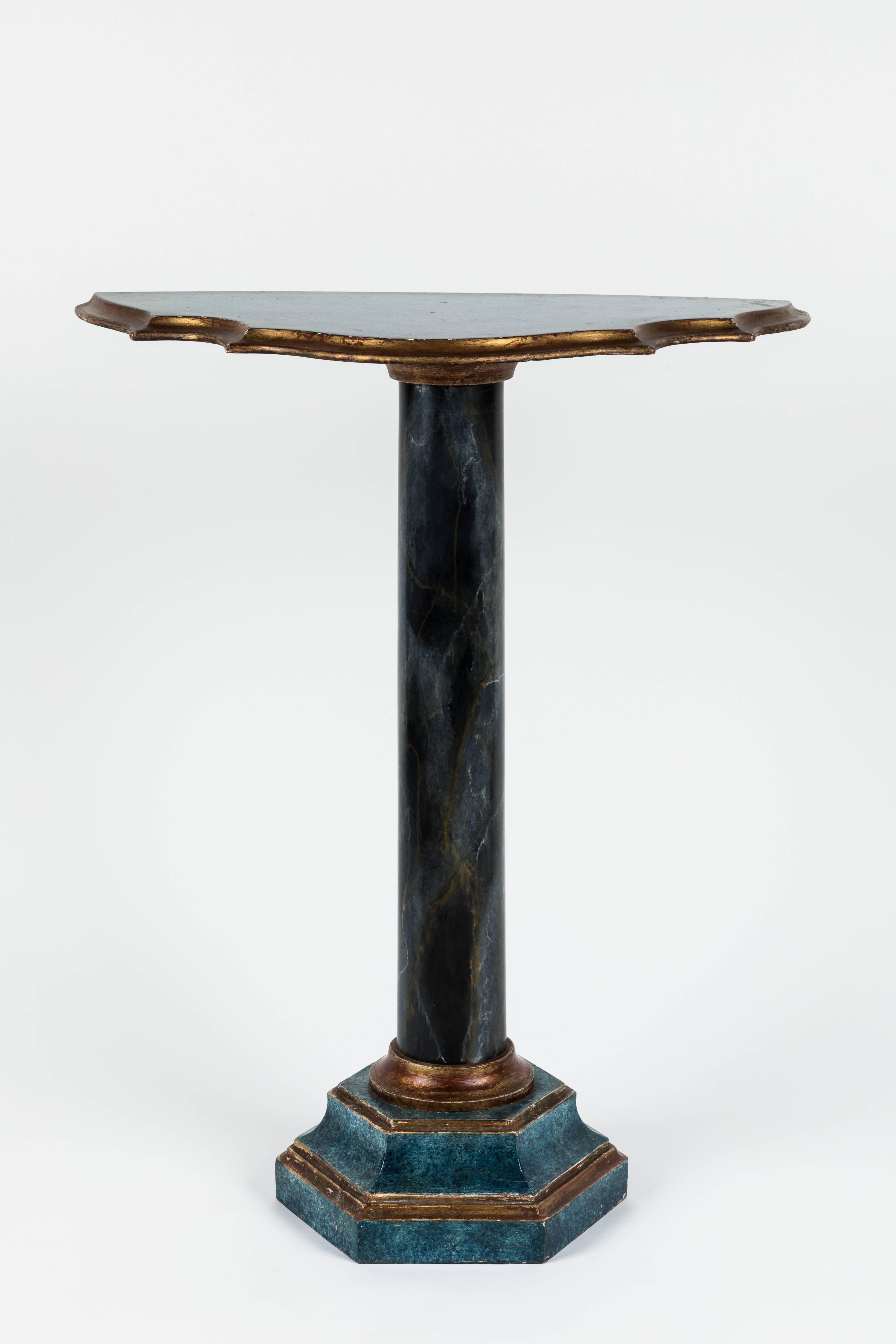 Italian console table finished with polychrome blue in color with partial gilt accents, petite scale table using antique parts.
Scalloped edging on table top, with tiered base.


  