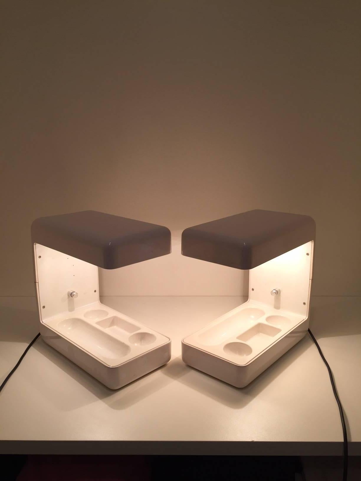 Wonderful pair of "Isos" table lamps designed by Giotto Stoppino for Tronconi in 1972. Lacquered cream aluminium structure with ABS internal tray.
   