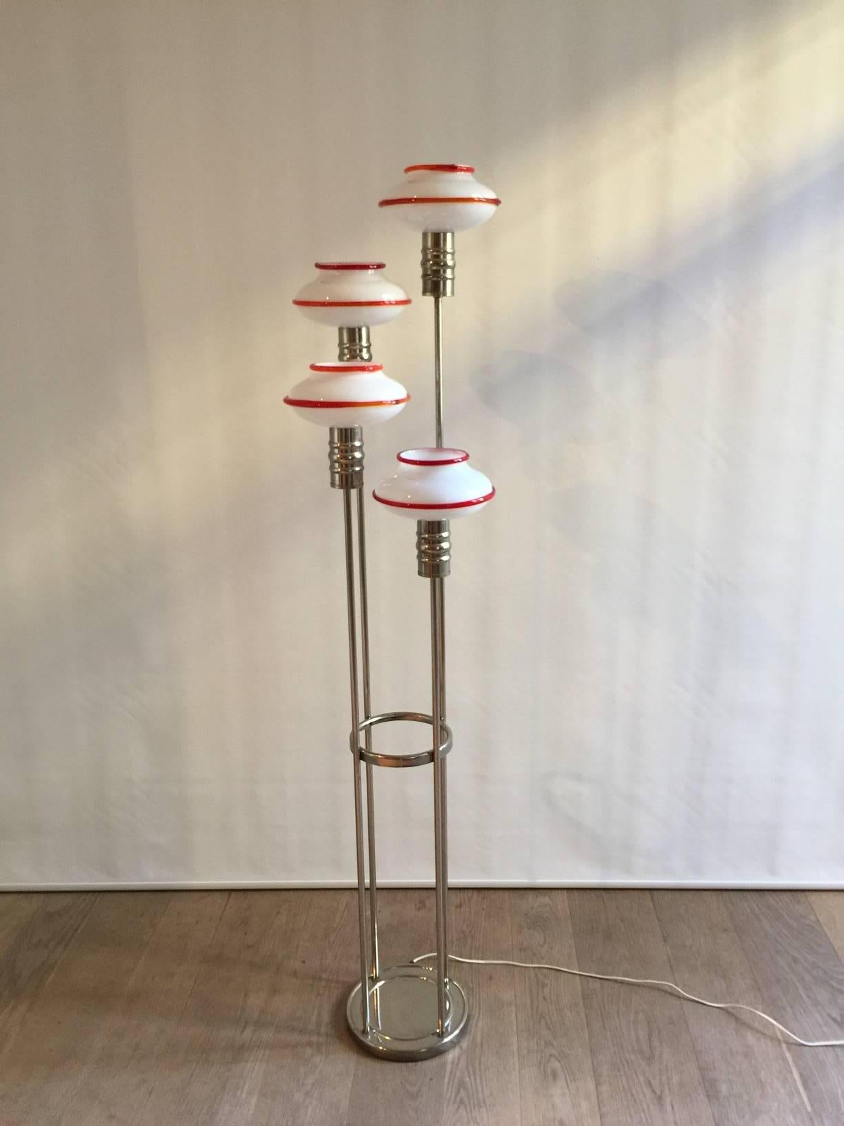 Very nice 1970 Italian floor lamp by Leucos with four Murano blown glass and a polished chrome frame and base. Each glass element measures 22 cm diameter and 11 cm height.