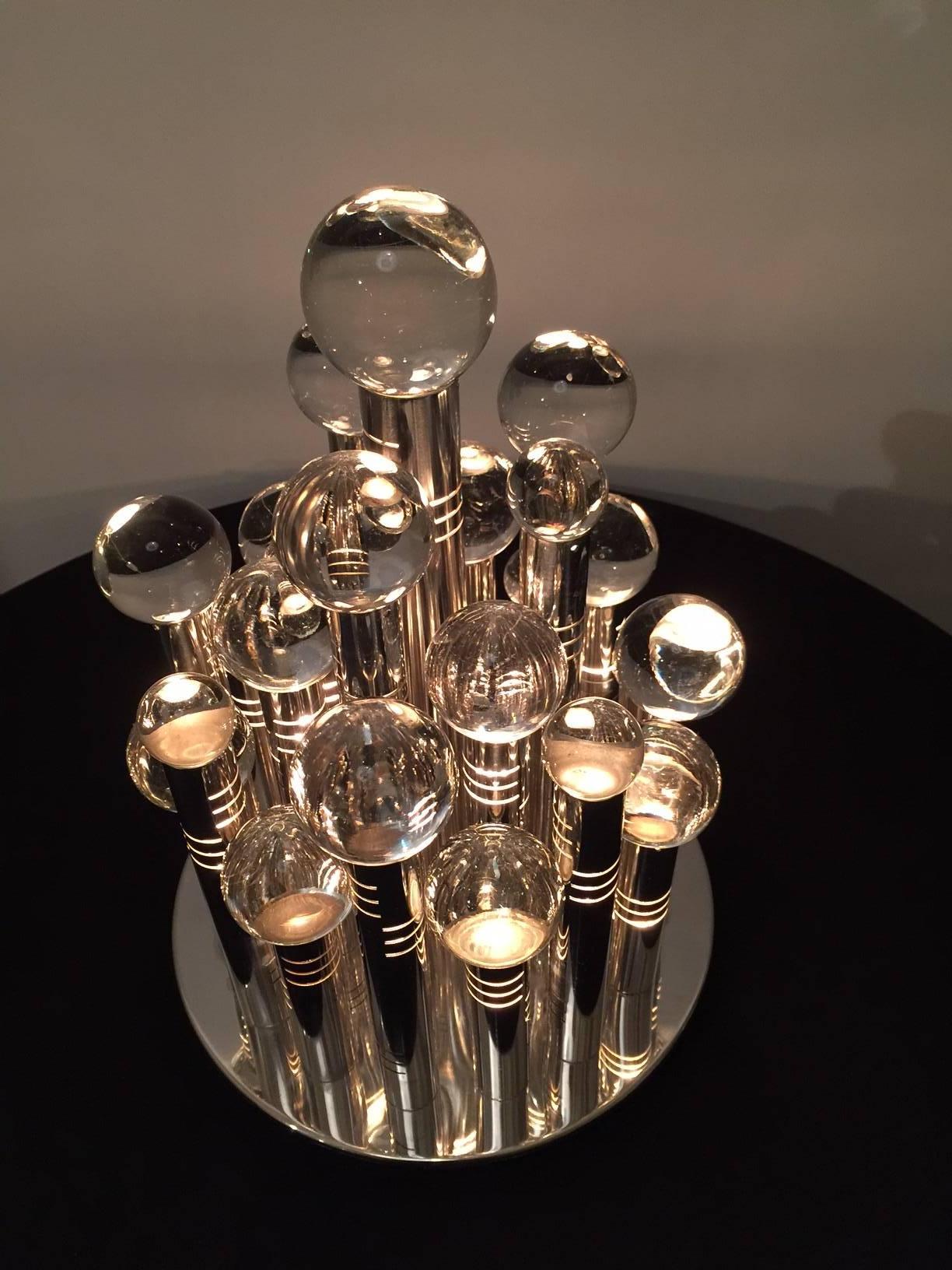 Outstanding light sculpture, tribute to Manhattan. Twenty-five-light point towers of chromed plated steel with crystal balls of different diameters on the top of each tower. Amazing light effects and terrific presence. Paper label under the base