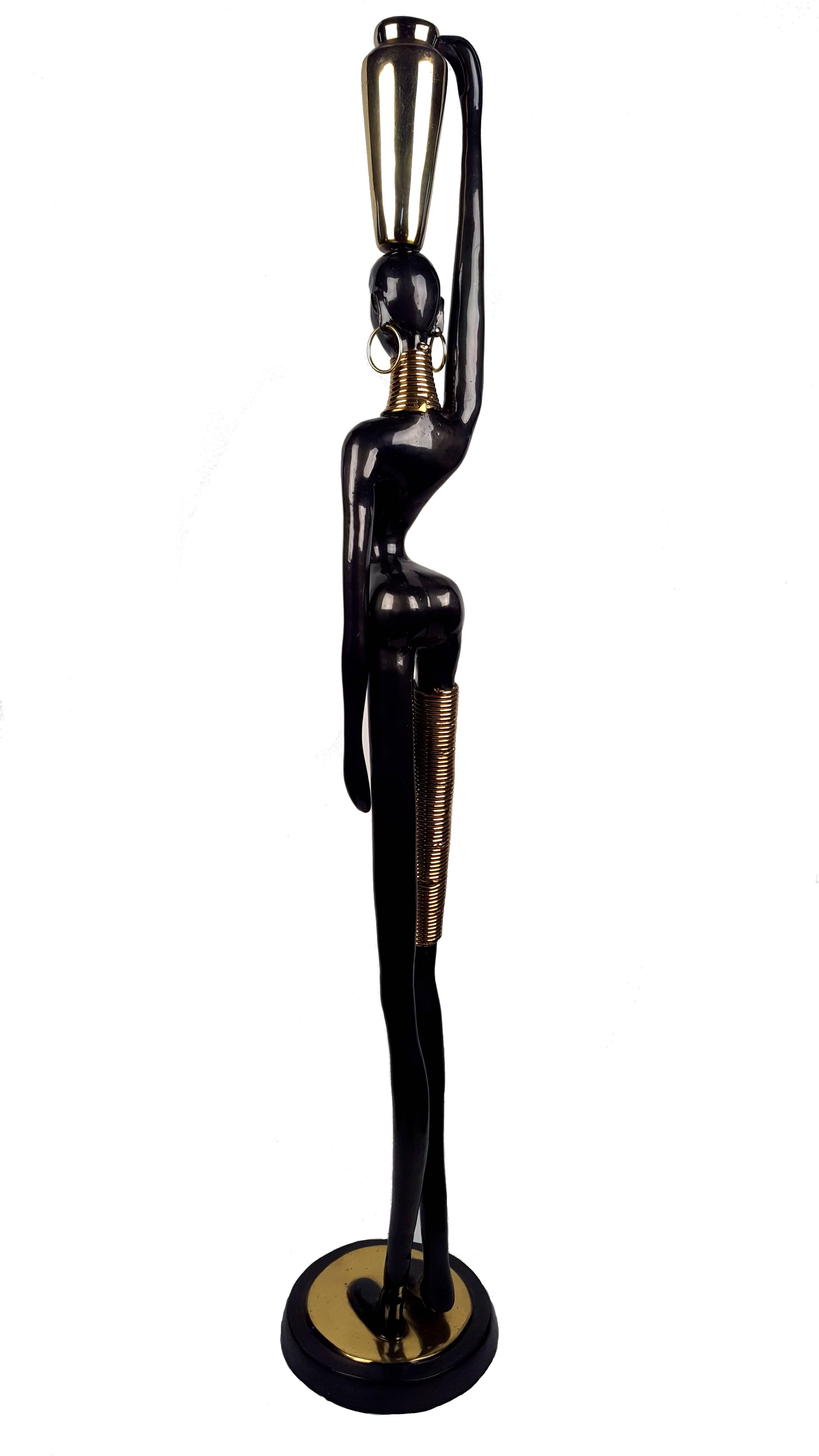 Bronze Ndebele African lady sculpture in Hagenauer style, “Africa in the jar”, circa 1950.

Measures: Height: 118 cm / 46.5 inch.
Diameter foot: 21 cm / 8.3 inch.

Ndebele women traditionally adorned themselves with a variety of ornaments, each