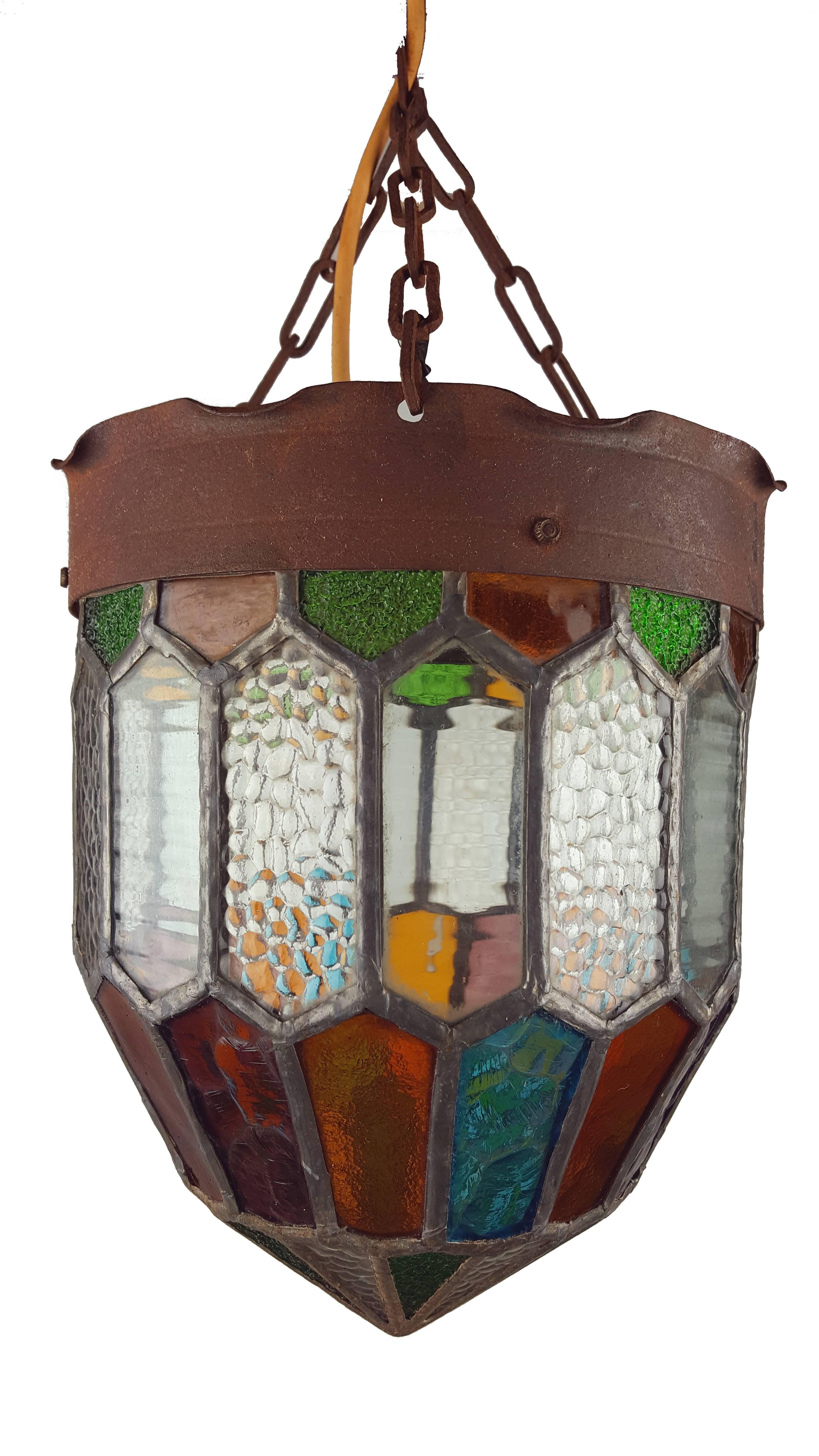 Antique Gothic style chandelier or light fixture colored stained glass hanging lantern. Original wiring.

Measures: Height (without hanging): 25 cm / 9.8 inch
Diameter: 21 cm / 8.3 inch.

Is in a good, undamaged condition. 
Please note that
