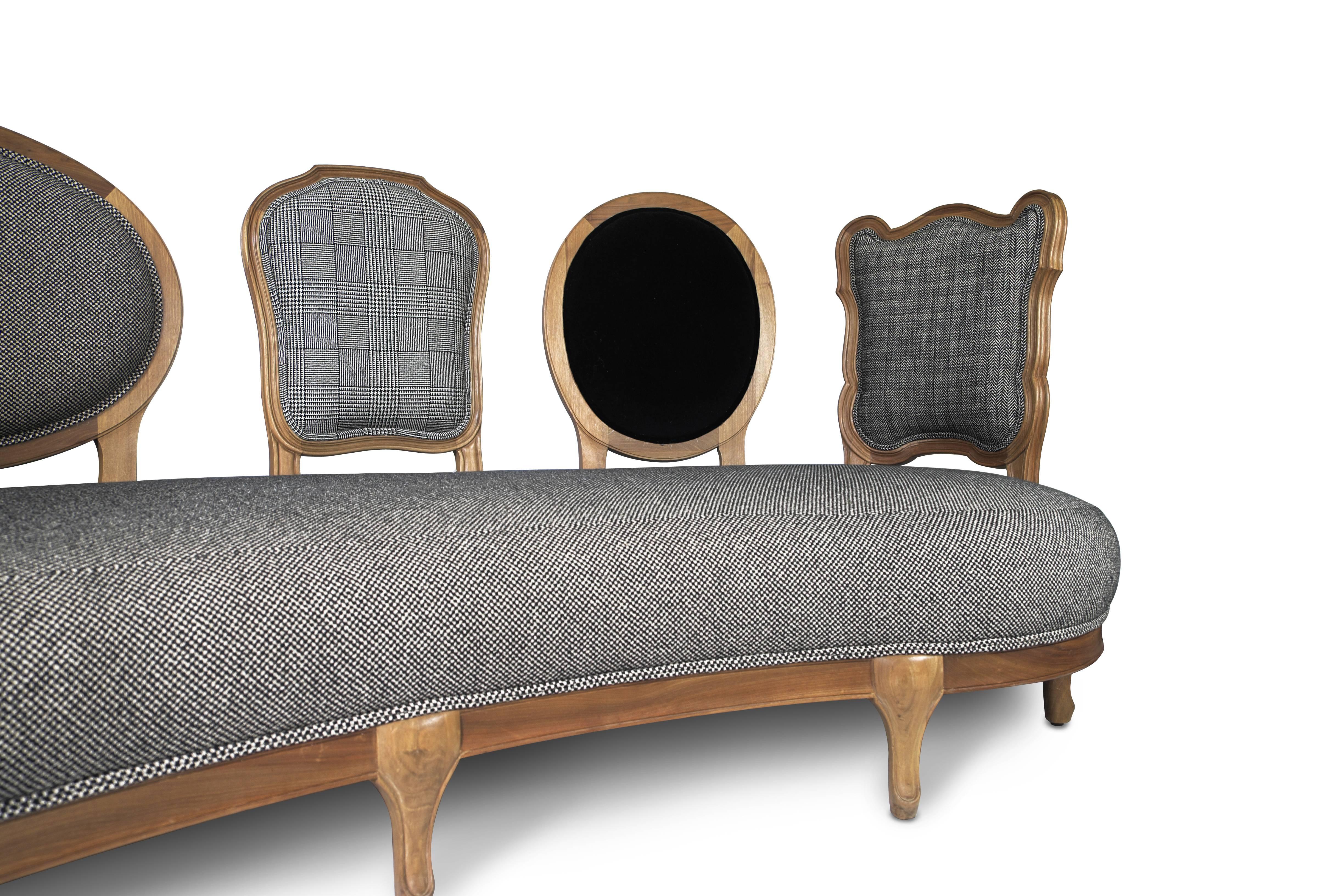 The key icon of Coates’ Scubist collection. This opulent and comfortable sofa brings timber-framed furniture into the 21st century. Its five backs are each upholstered in patterned tweed fabric.

Carved frame in solid walnut, seat and backs