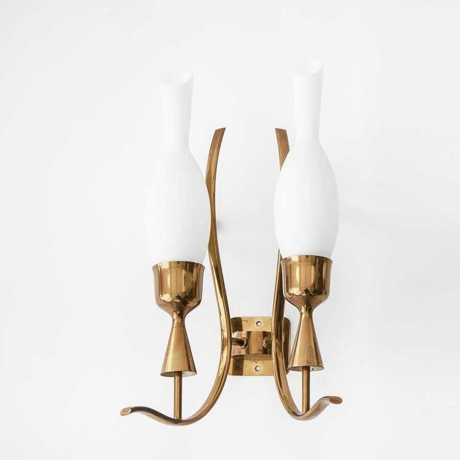 Pair of wall sconces in brass and opal glass.