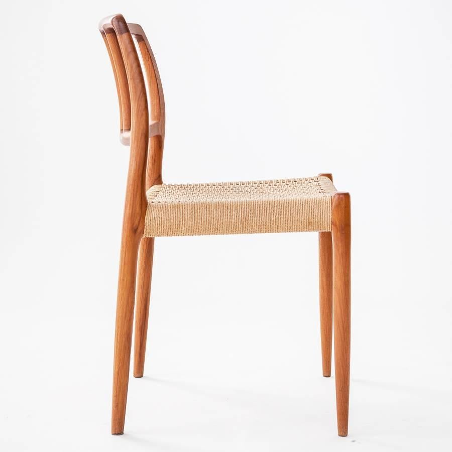 Niels O. Moller classical design: a set of four dining chairs with frames made of solid teak, seats with natural cord.