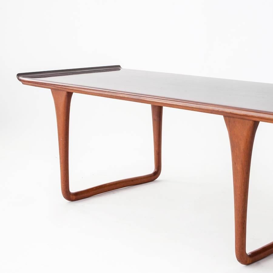 Svante Skogh 1950s Rectangular Rosewood Coffee Table with Curved Top for Seffle Möbelfabrik AB. Beautiful sculptural legs. Very good vintage condition